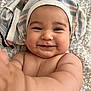 Leon joined the competition — help win amazing prizes! baby, smiling, face, arm, skin, cheeks, cloth, striped_cloth, headwear, cute, infant, happy, portrait, closeup, baby_skin, child, expression, indoors, laying_down, playful