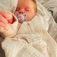 Norah joined the competition — help win amazing prizes! baby, sleeping, pacifier, blanket, soft, cute, infant, child, cozy, resting, indoors, closeup, face, peaceful, wrapped, warm, comfort, adorable, newborn, pink