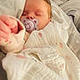baby, sleeping, pacifier, blanket, soft, cute, infant, child, cozy, resting, indoors, closeup, face, peaceful, wrapped, warm, comfort, adorable, newborn, pink