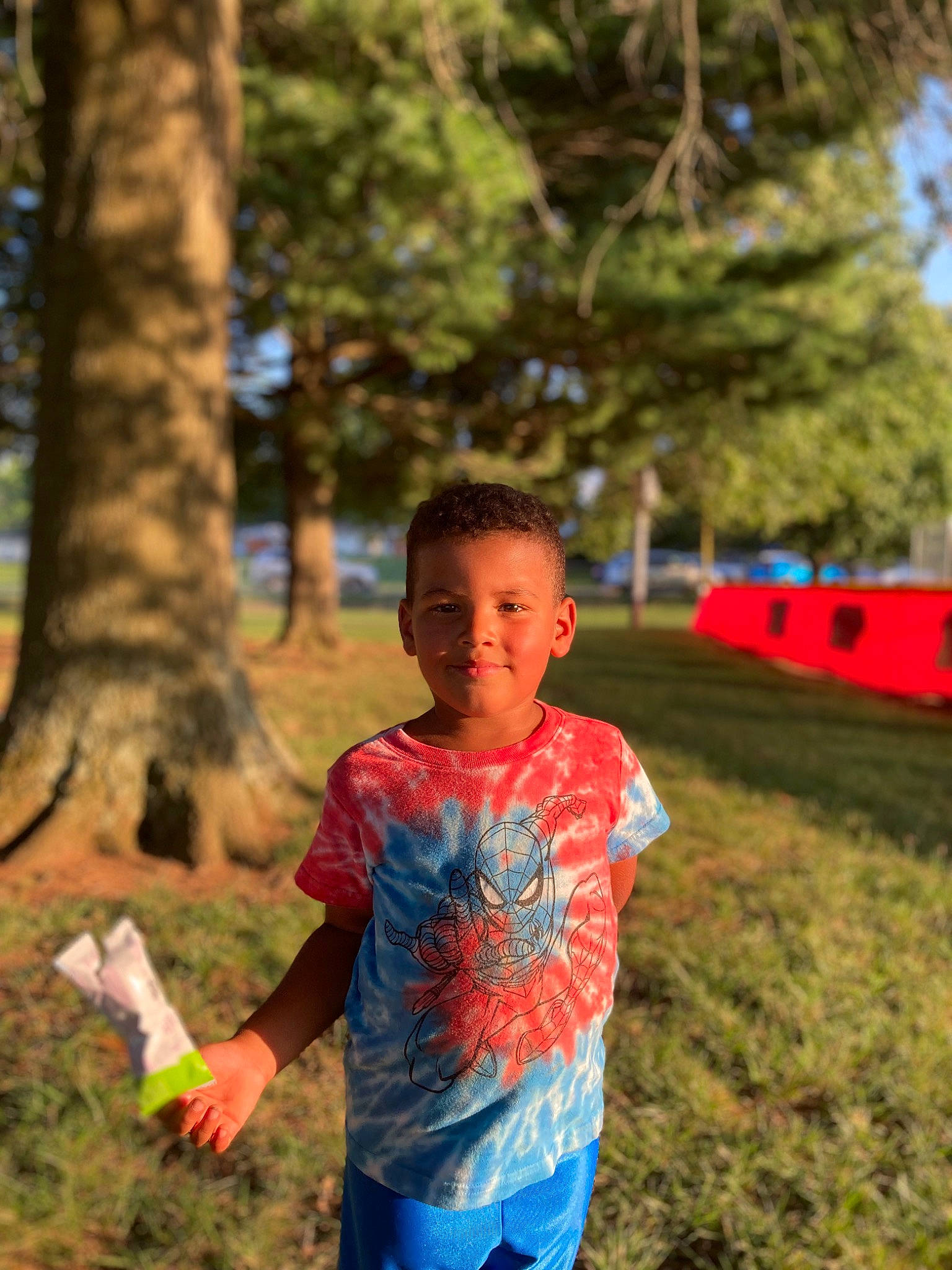 Tyson joined the competition — help win amazing prizes! child, community, electric_blue, facial_expression, fun, grass, grassland, happy, joy, leisure, mammal, people_in_nature, person, plant, recreation, sleeve, soil, standing, t_shirt, tree