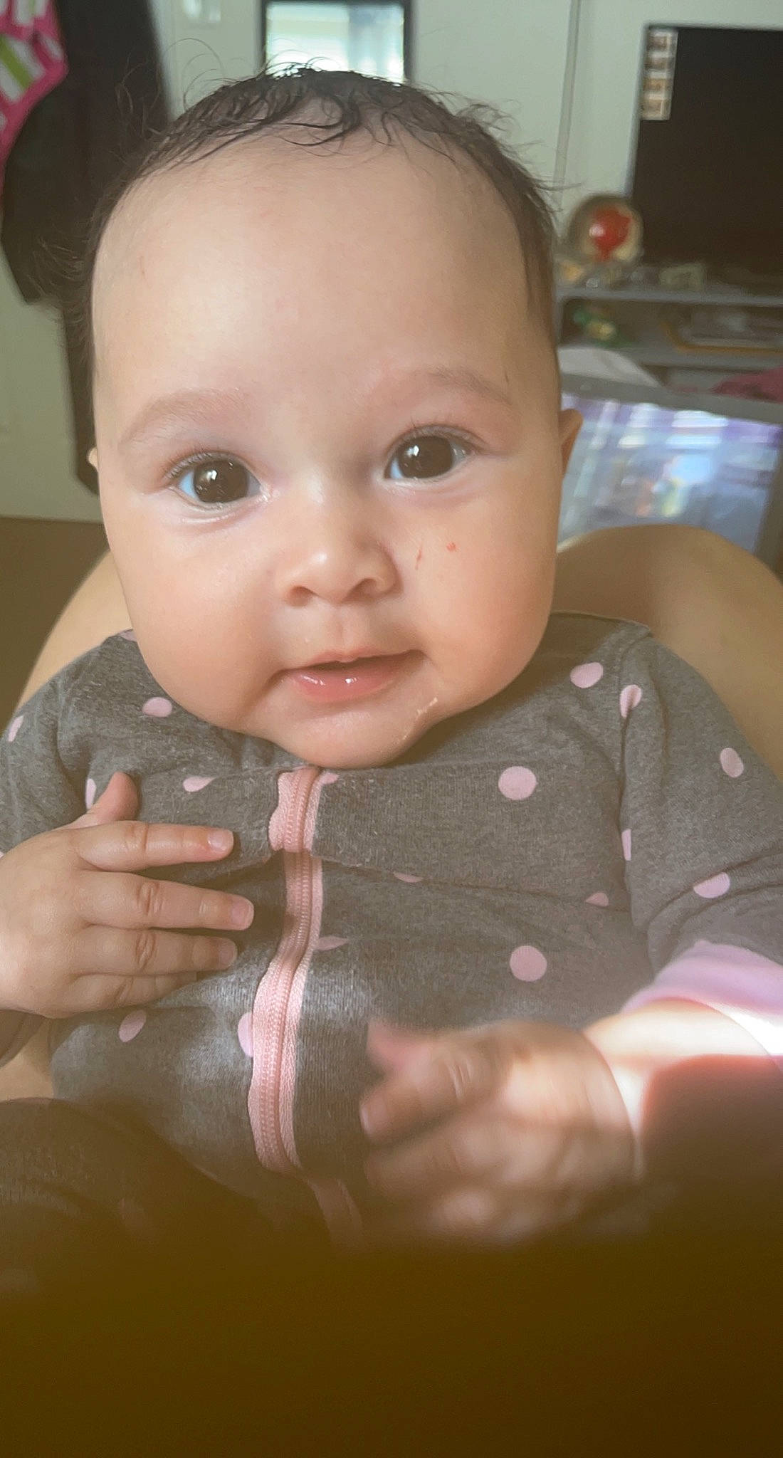 Alani is registered to the contest to win money with this photo: baby, baby_toddler_clothing, cheek, dress, ear, eye, eyebrow, eyelash, finger, gesture, head, human_body, iris, lip, mouth, neck, nose, person, skin, sleeve