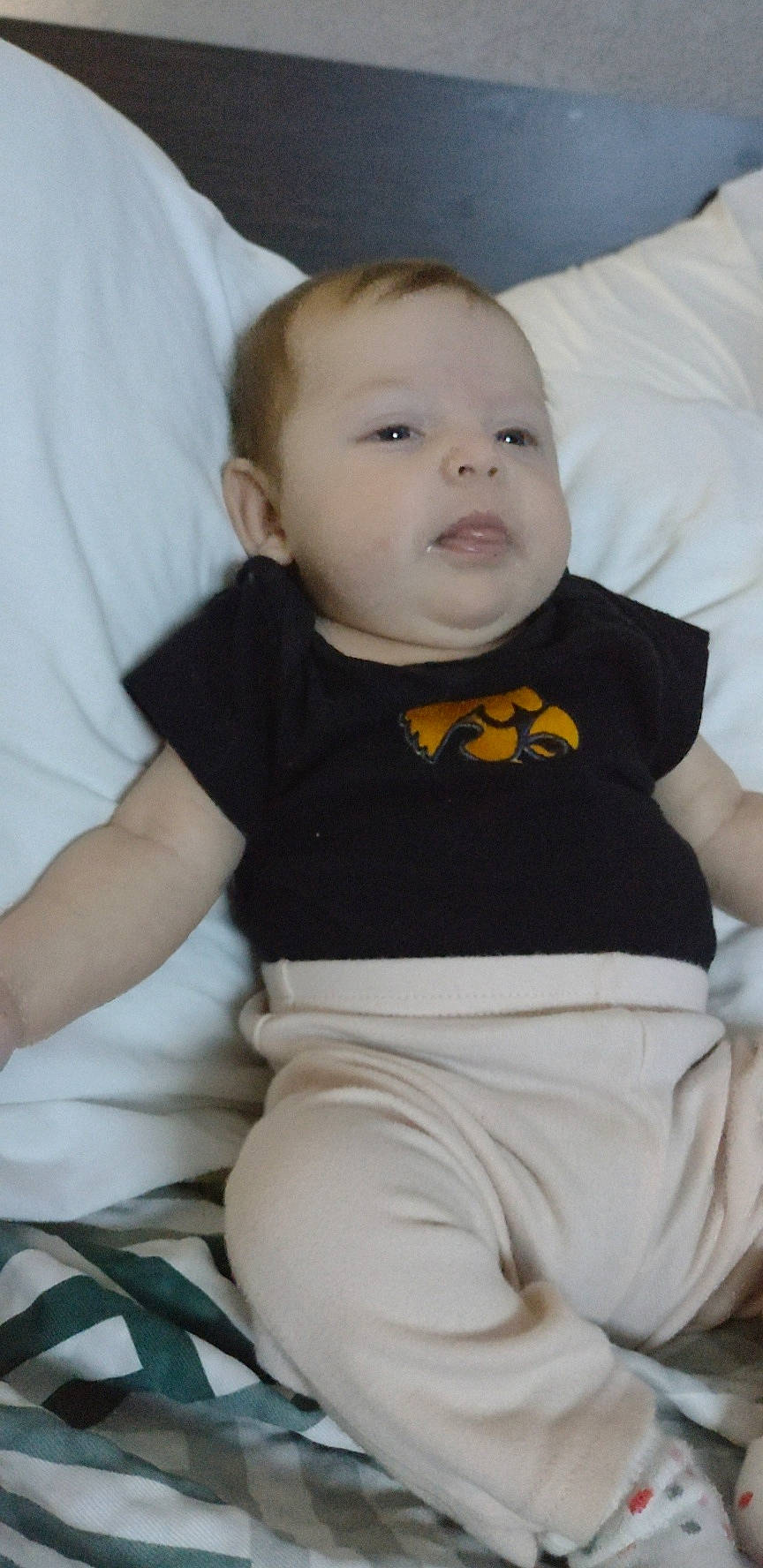 Kayleigh joined the competition — help win amazing prizes! baby, baby_products, baby_toddler_clothing, cheek, collar, comfort, eye, grey, happy, head, human_body, linens, long_sleeved_t_shirt, neck, pattern, person, product, sitting, sleeve, t_shirt