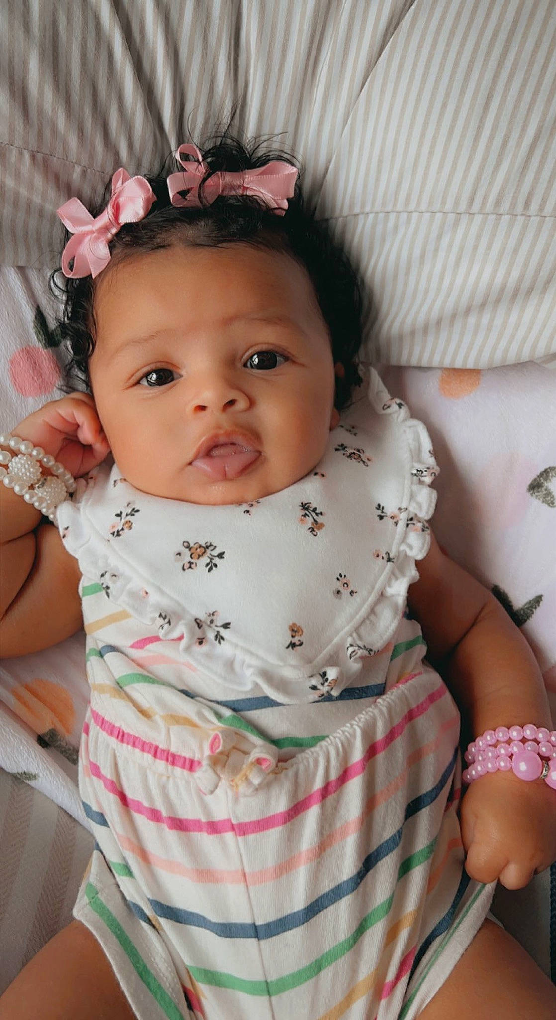 Hendrix is registered to the contest to win money with this photo: baby, baby_toddler_clothing, cheek, chin, comfort, eye, eyelash, hairstyle, happy, headgear, iris, lip, mouth, neck, nose, person, pink, skin, sleeve, textile