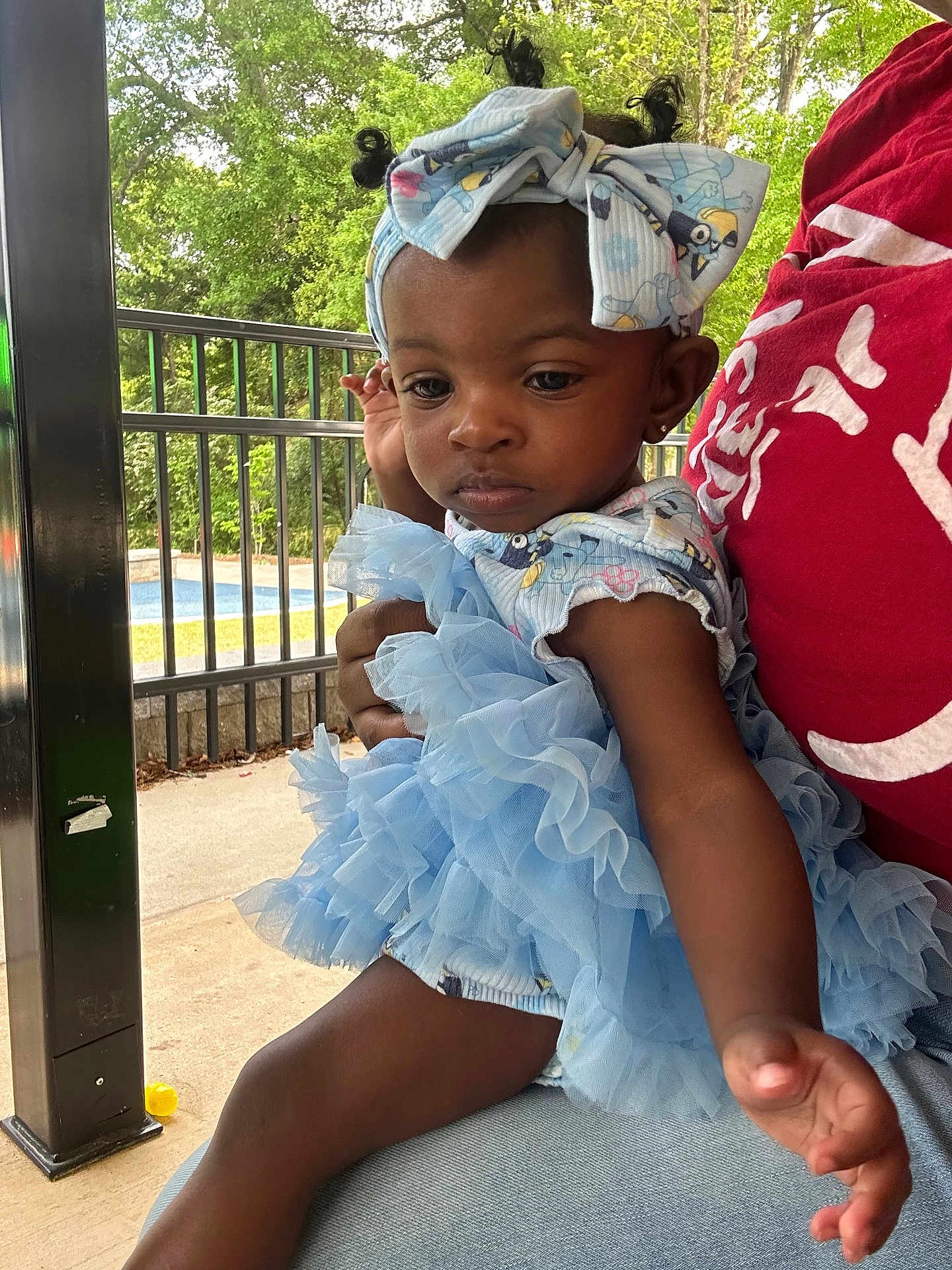 Zynaisjah joined the competition — help win amazing prizes! baby, blue_dress, casual, child, cute, daylight, expression, fashion, fence, hand, headband, outdoor, person, pool, portrait, red_shirt, sitting, toddler, trees, young_child