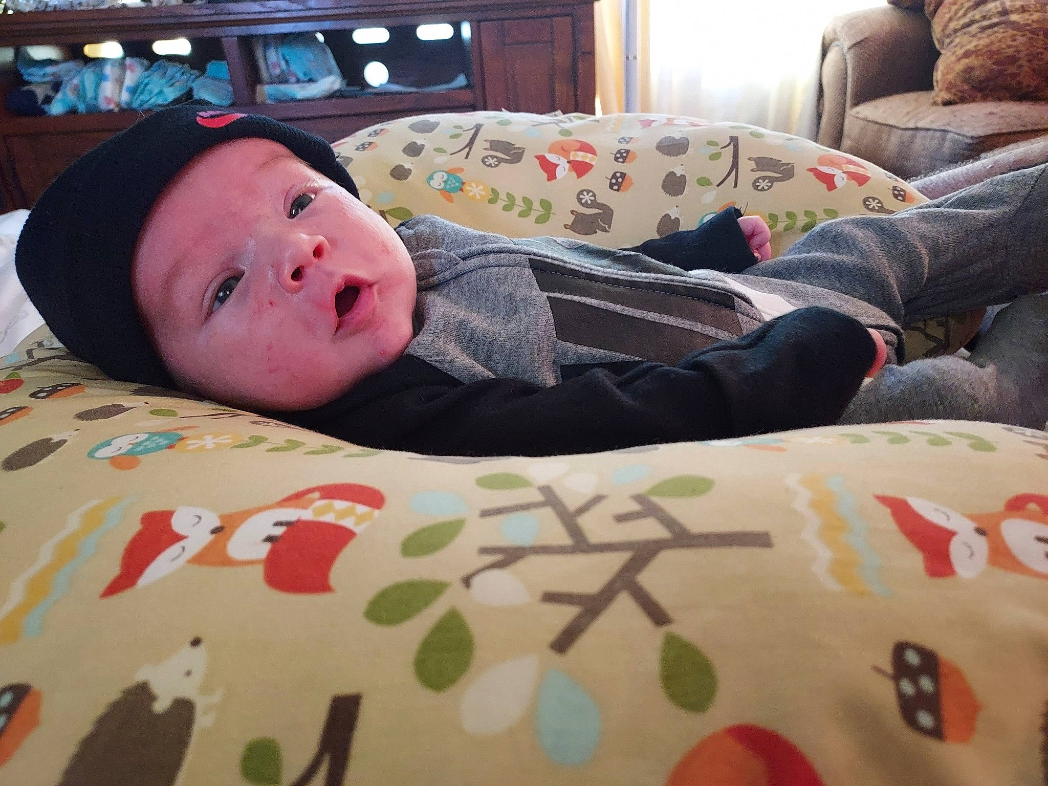 Layne joined the competition — help win amazing prizes! baby, baby_toddler_clothing, bedding, child, comfort, couch, elbow, headwear, human_leg, linens, nap, pattern, person, room, sitting, sleep, sleeve, t_shirt, textile, toddler