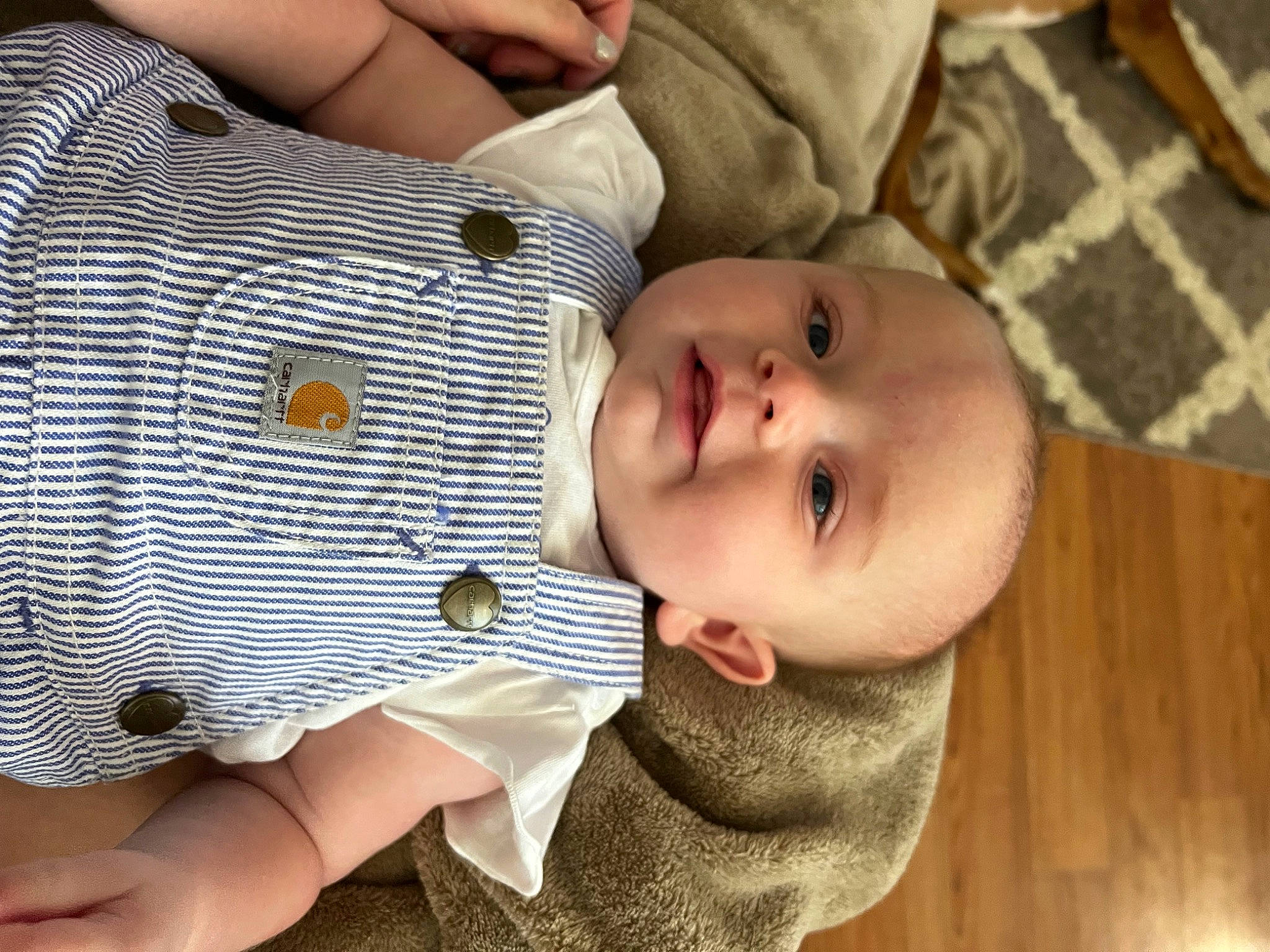 Alyvia is registered to the contest to win money with this photo: baby, baby_products, baby_toddler_clothing, cheek, child, comfort, eye, eyelash, finger, gesture, happy, hardwood, nail, nose, pattern, person, skin, sleeve, thumb, toddler