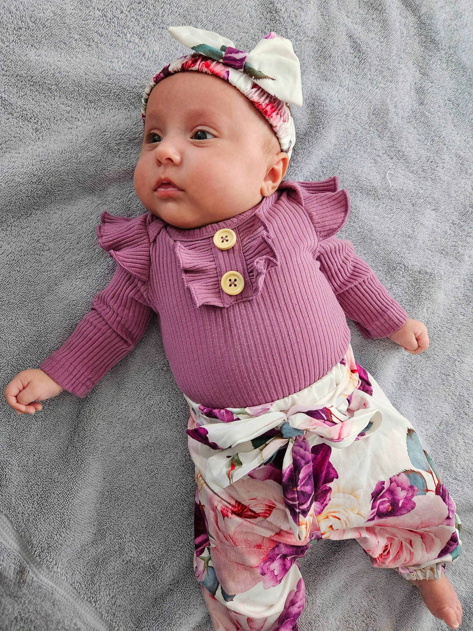 Kaely joined the competition — help win amazing prizes! baby, baby_products, baby_toddler_clothing, button, cap, doll, dress, eye, face, fashion_accessory, head, headwear, magenta, outerwear, pattern, person, pink, purple, sleeve, textile