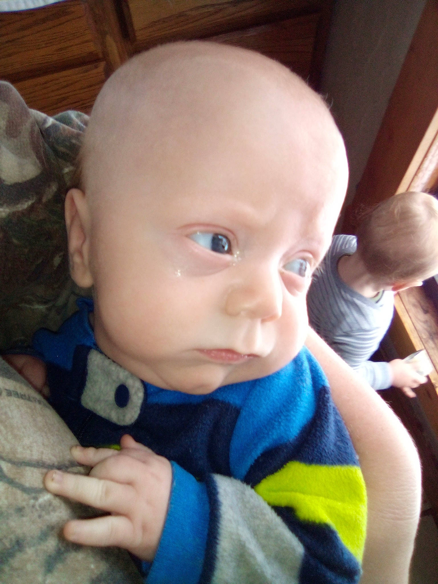 Randy is registered to the contest to win money with this photo: baby, cheek, child, chin, ear, eye, face, finger, forehead, hand, head, lip, mouth, nose, person, sitting, skin, smile, toddler