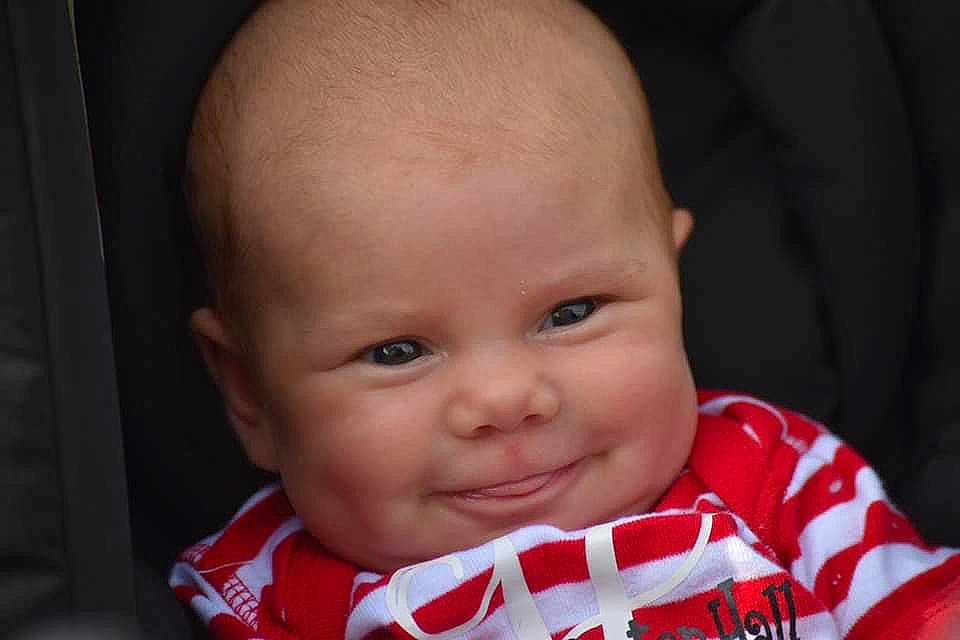 Whitley is registered to the contest to win money with this photo: baby, cheek, child, chin, close_up, eye, eyebrow, face, facial_expression, forehead, head, iris, joy, lip, mouth, nose, organ, person, red, skin