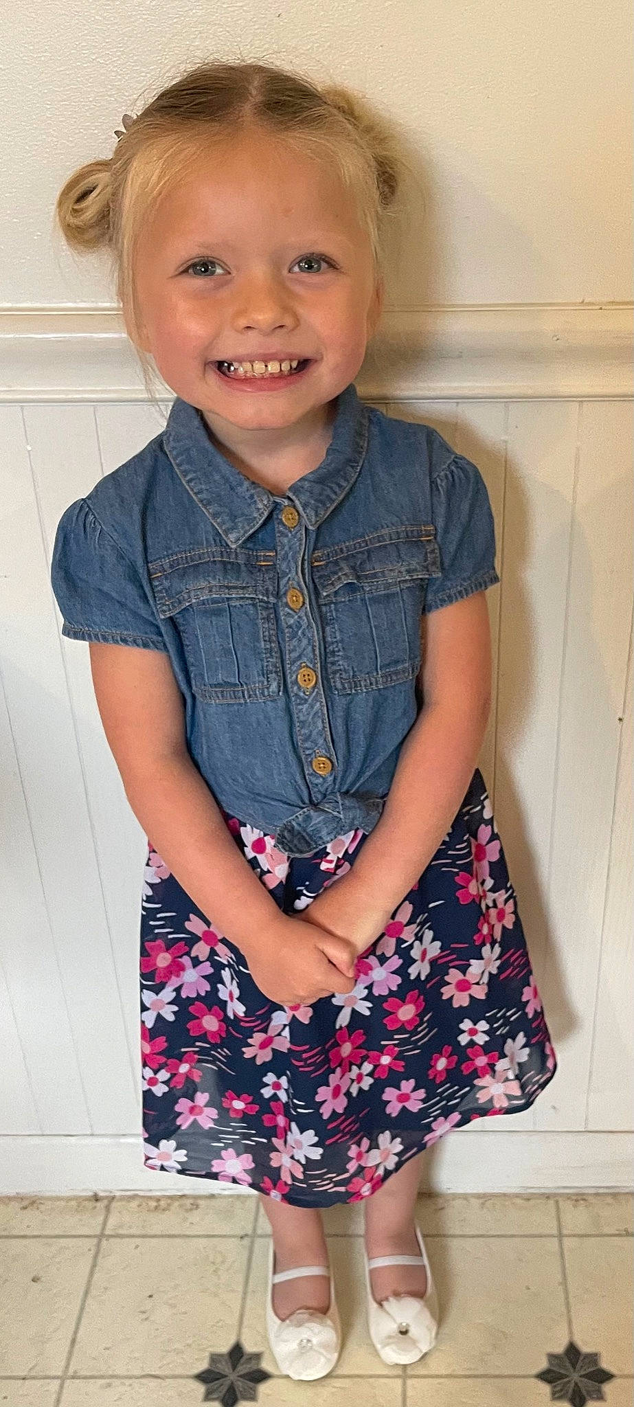 Mylie is registered to the contest to win money with this photo: baby_toddler_clothing, blue, clothing, collar, day_dress, dress, dress_shirt, face, hairstyle, happy, joy, neck, person, pink, plaid, shirt, skin, sleeve, smile, standing