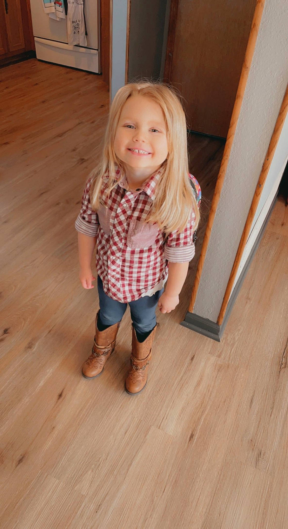 Avalynn is registered to the contest to win money with this photo: baby_toddler_clothing, blond, eye, face, floor, flooring, foot, hardwood, head, human_leg, joy, laminate_flooring, leg, pattern, person, plank, smile, toddler, varnish, wood