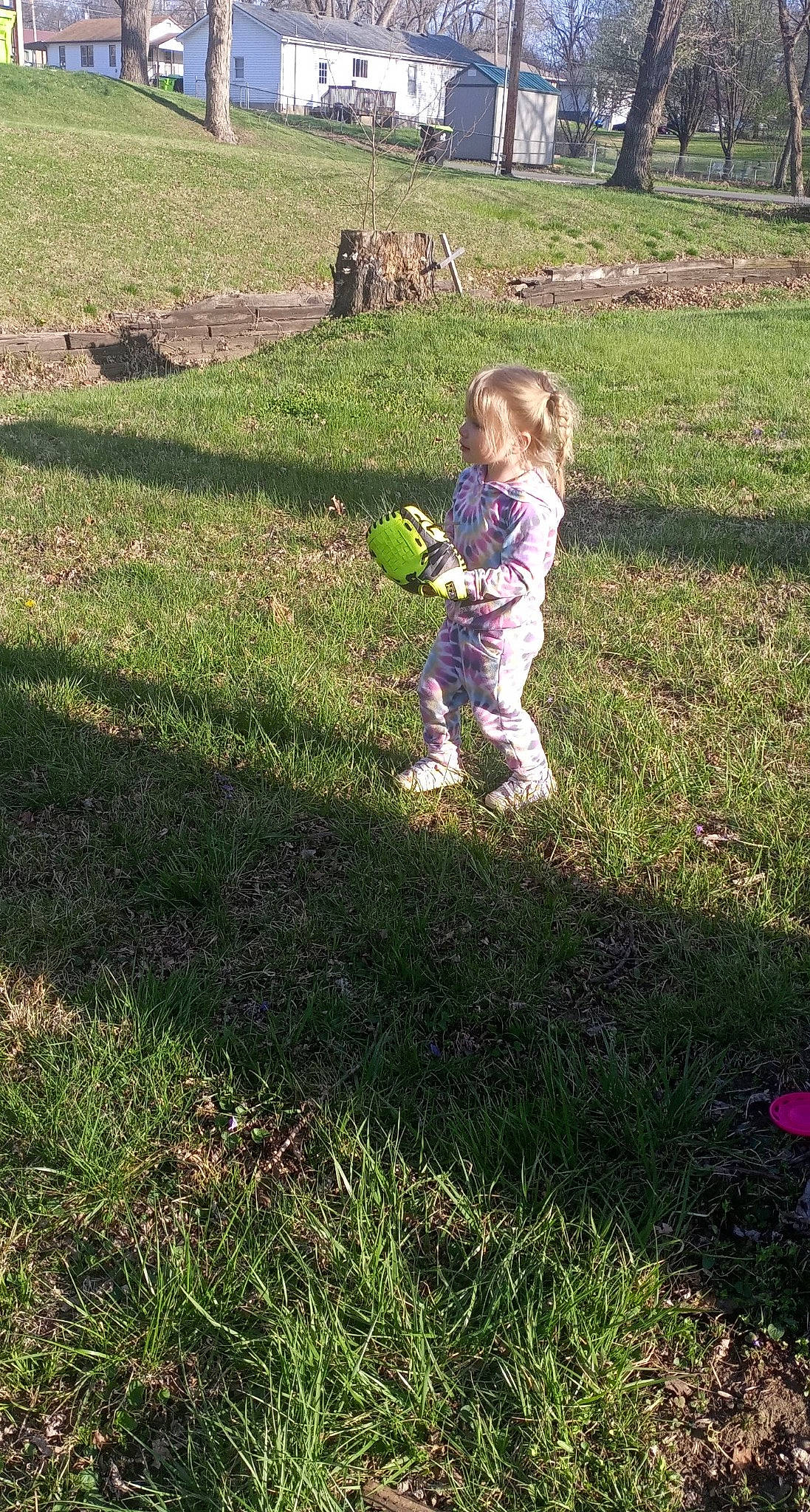 Avalynn is registered to the contest to win money with this photo: ball, child, field, fun, garden, grass, grassland, groundcover, happy, landscape, lawn, meadow, pasture, people_in_nature, person, plant, prairie, shadow, soil, toddler