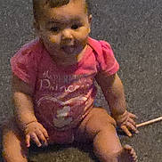 Randvi joined the competition — help win amazing prizes! baby, infant, child, pink_clothing, sitting, carpet, indoor, cute, smiling, young, person, human, chubby_cheeks, short_hair, barefoot, hand, foot, portrait, childhood, casual