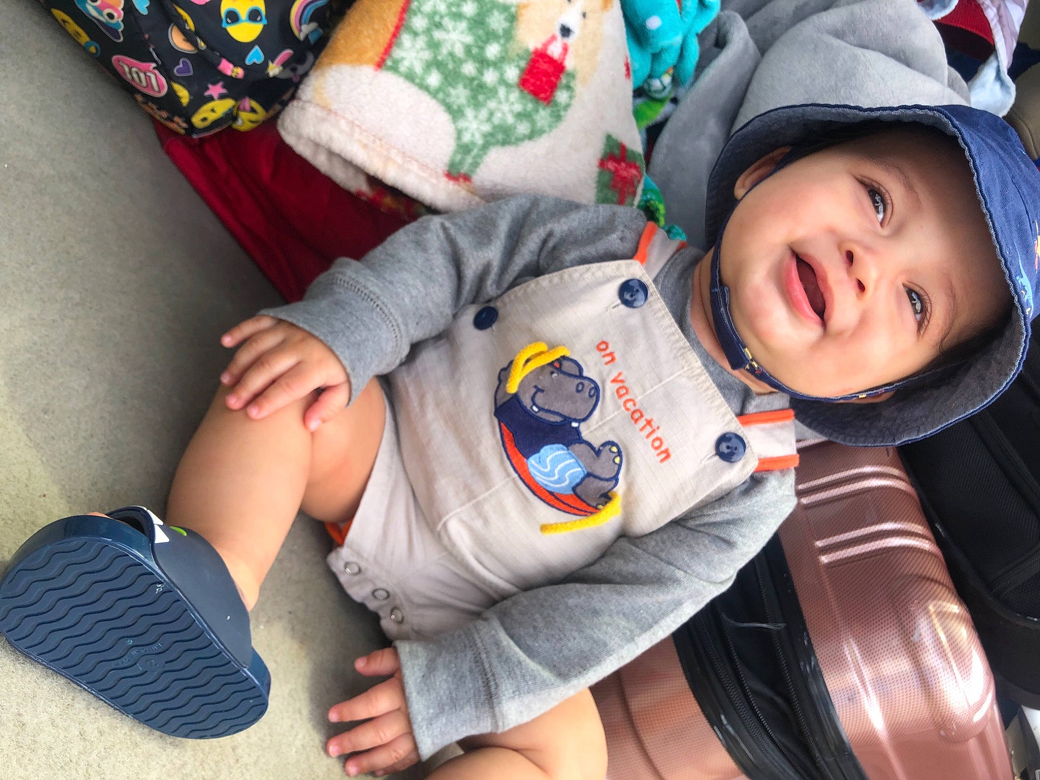 Zaydrian joined the competition — help win amazing prizes! baby, baby_toddler_clothing, cap, carmine, child, comfort, finger, foot, fun, happy, headwear, human_leg, leg, outerwear, pattern, person, sitting, sleeve, smile, thumb