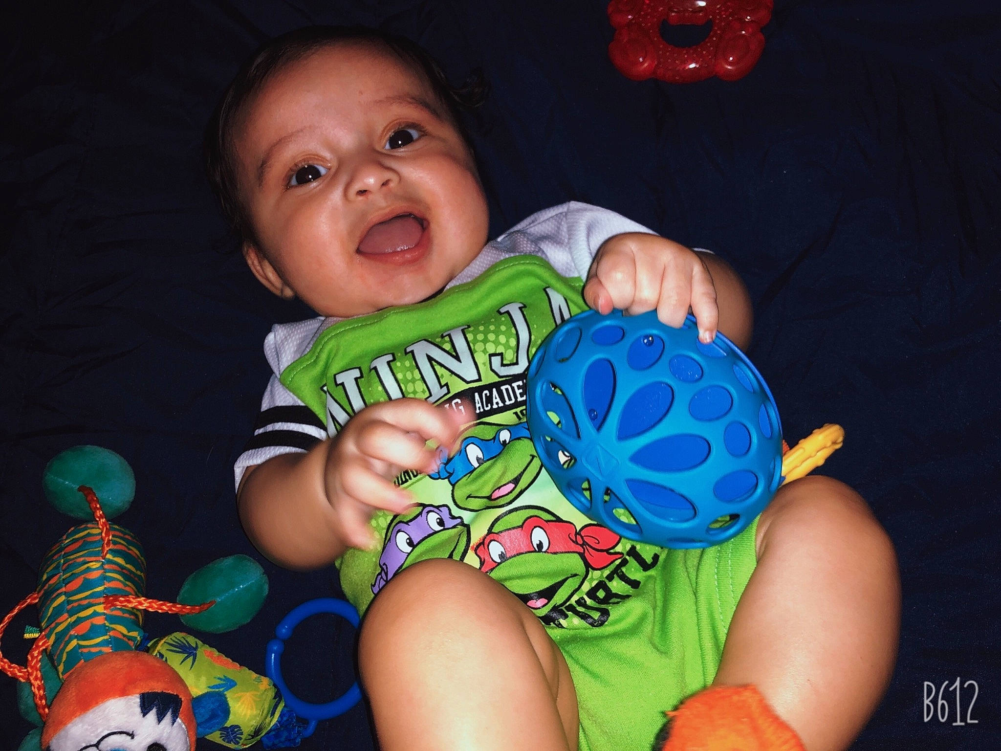 Zaydrian is registered to the contest to win money with this photo: arm, baby, baby_toddler_clothing, blue, cheek, child, cool, eye, face, facial_expression, finger, green, hand, happy, head, person, product, skin, sleeve, smile