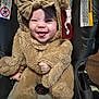 Chanel is registered to the contest to win money with this photo: baby, child, costume, bear_costume, car_seat, smiling, tongue_out, cute, fluffy, headwear, infant, happy, indoors, seatbelt, adorable, soft_texture, childrens_clothing, funny_face, young_child, portrait