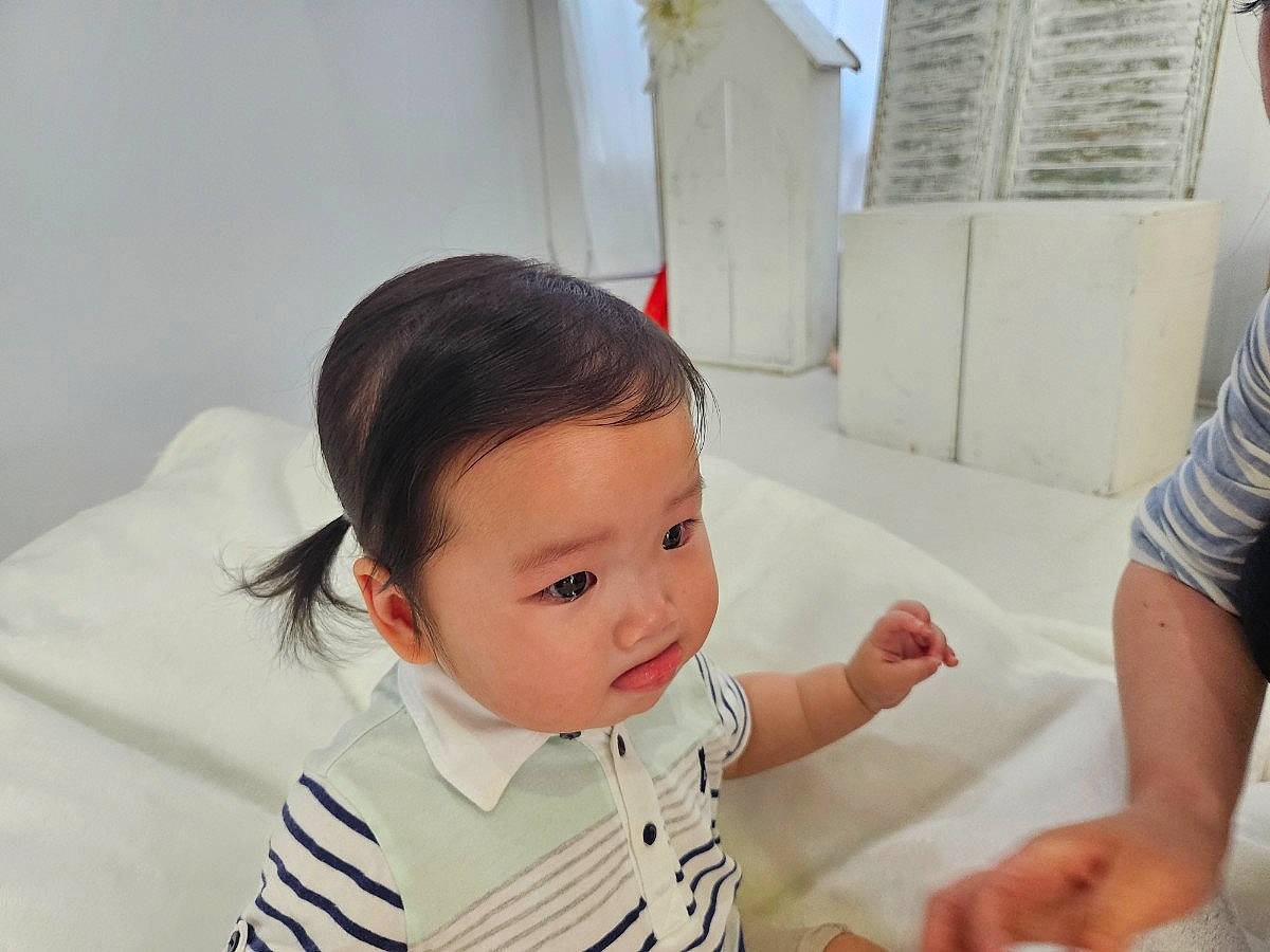 Isla joined the competition — help win amazing prizes! baby, baby_products, baby_toddler_clothing, bib, chair, cheek, child, comfort, fun, gesture, happy, person, room, sitting, skin, sleeve, t_shirt, thumb, toddler