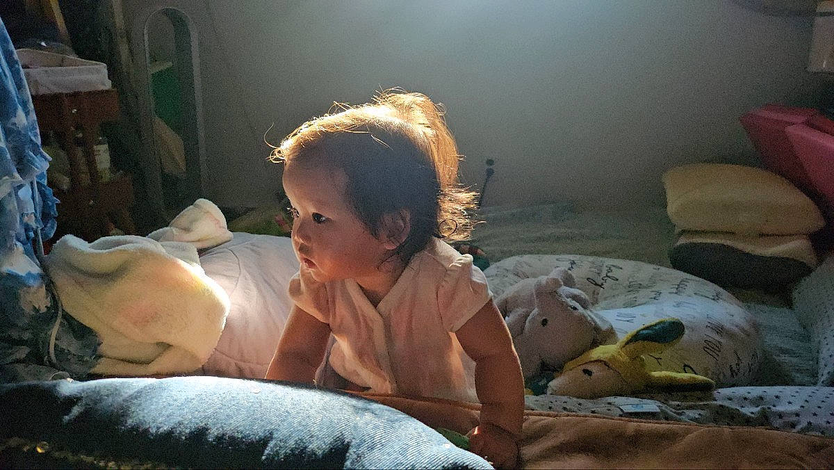 Isla joined the competition — help win amazing prizes! baby, bed, bedding, bedtime, blanket, child, comfort, darkness, flash_photography, fun, grass, happy, linens, mouth, nap, person, room, sitting, sleep, toddler