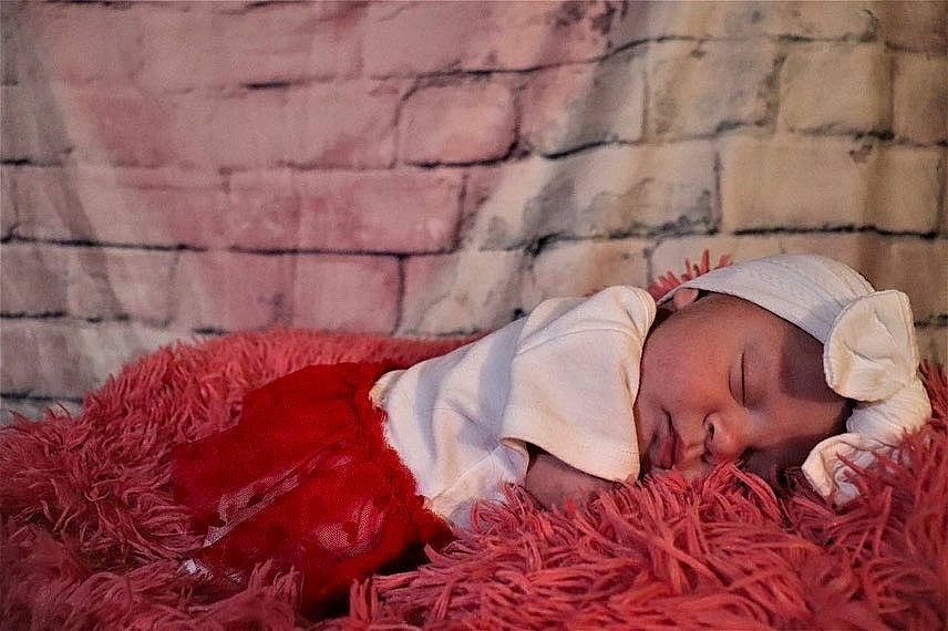 Cattleya joined the competition — help win amazing prizes! baby, baby_sleeping, bedding, brick, cap, carmine, child, comfort, flooring, fur, grass, headwear, knit_cap, linens, magenta, nap, peach, person, portrait_photography, sitting
