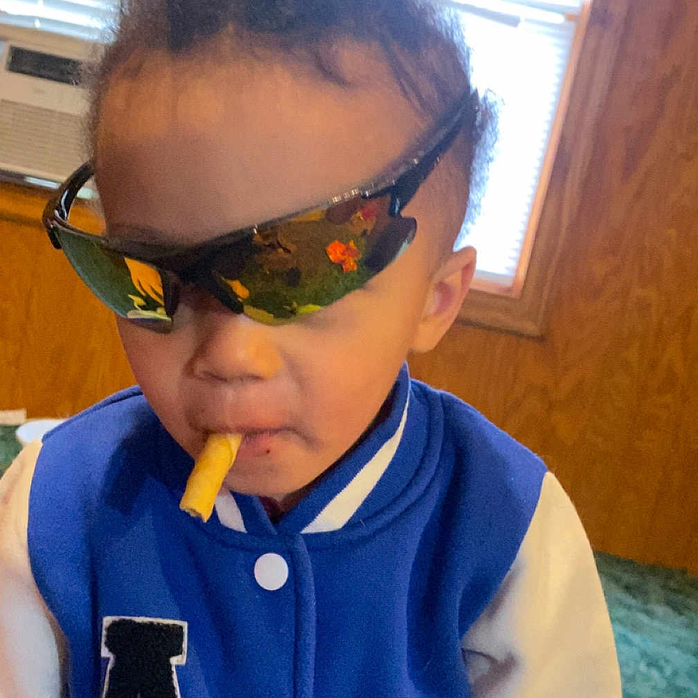 Bentley joined the competition — help win amazing prizes! accessories, baby, bodypart, clothing, coat, door, face, finger, food, glasses, hand, head, jacket, person, photography, portrait, smoke, sunglasses, t_shirt, wood