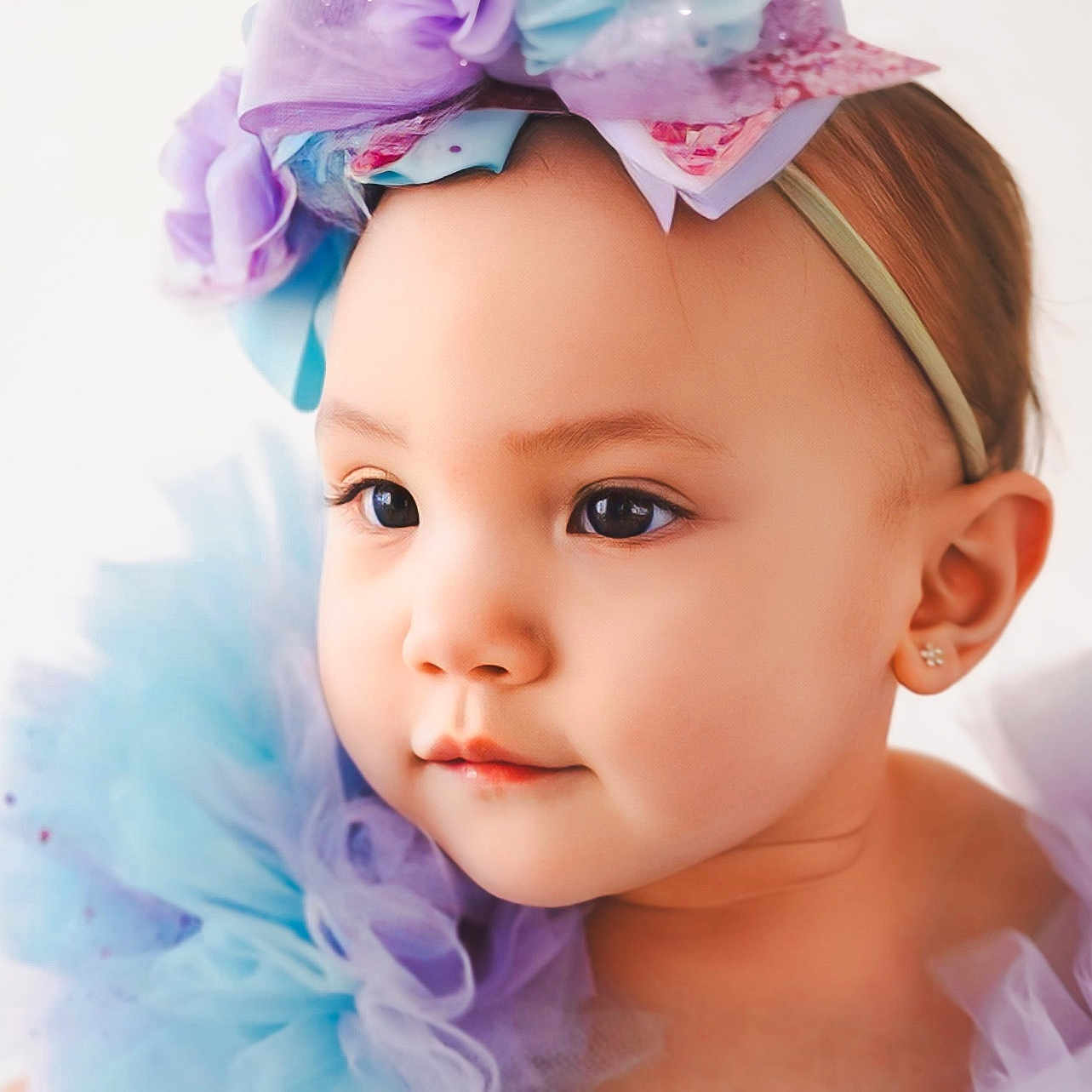 Elliana is registered to the contest to win money with this photo: accessories, baby, bandana, bodypart, bonnet, clothing, dress, face, happy, hat, head, headband, jewelry, newborn, person, photography, portrait, shoulder, smile, toy