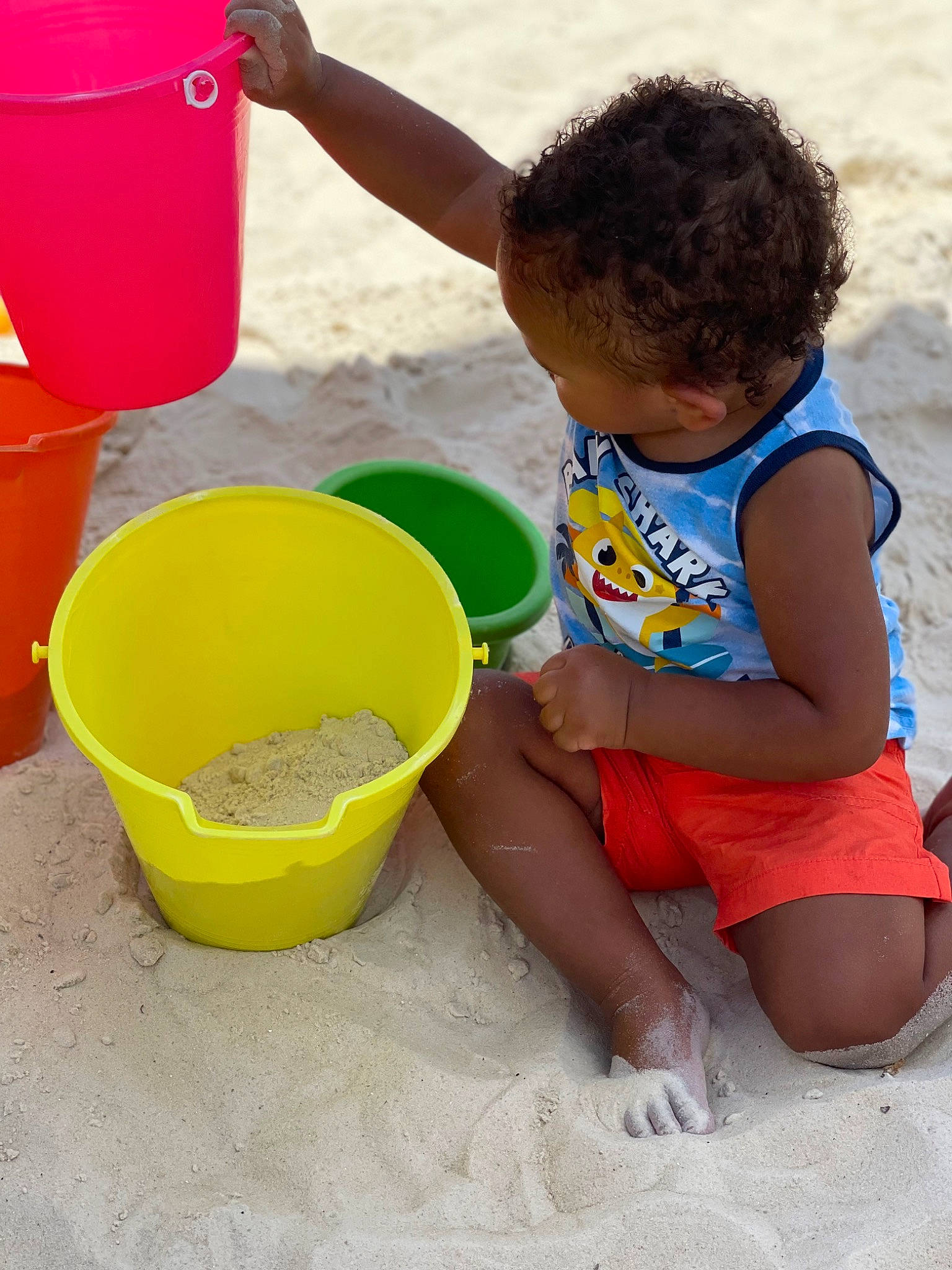 Kalvin joined the competition — help win amazing prizes! baby_toddler_clothing, beach, bucket, child, fun, happy, leisure, people_on_beach, person, photograph, plastic, play, product, recreation, sand, shorts, sitting, soil, toddler, water