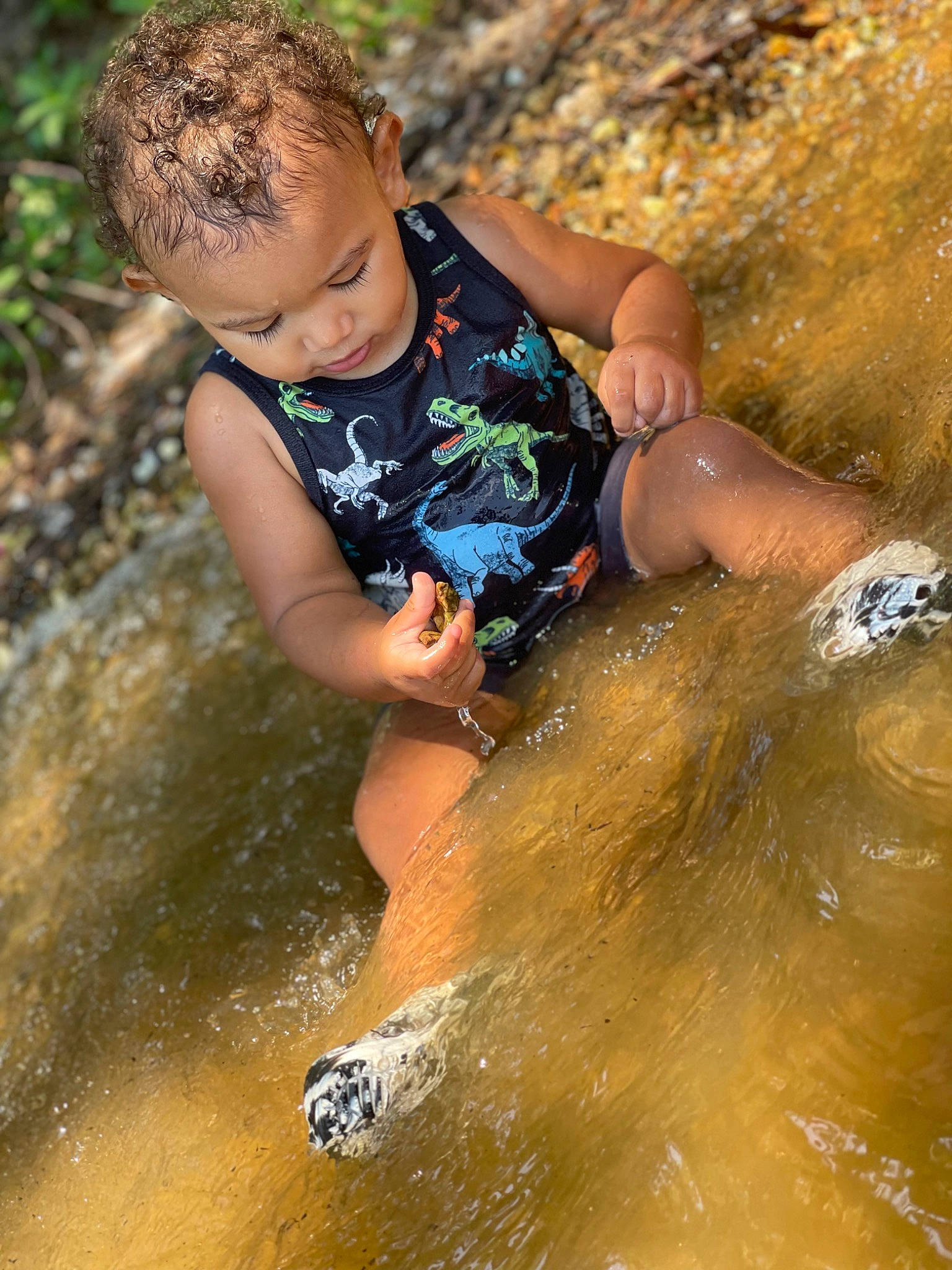 Kalvin is registered to the contest to win money with this photo: adventure, bathing, child, fun, happy, lake, leisure, people_in_nature, person, recreation, rock, shorts, soil, stream, swimwear, toddler, water, water_feature, water_resources, watercourse