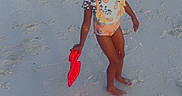 Genesis is registered to the contest to win money with this photo: beach, braids, buildings, child, footprints, holiday, ocean, outdoor, people, play, sand, shoreline, shovel, sky, summer, sunset, swimsuit, toy, vacation, water
