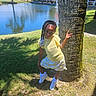 Genesis joined the competition — help win amazing prizes! child, girl, tree, grass, lake, water, house, building, sunlight, shadow, outdoor, nature, peace_sign, skirt, yellow_top, shoes, braided_hair, daylight, posing, park