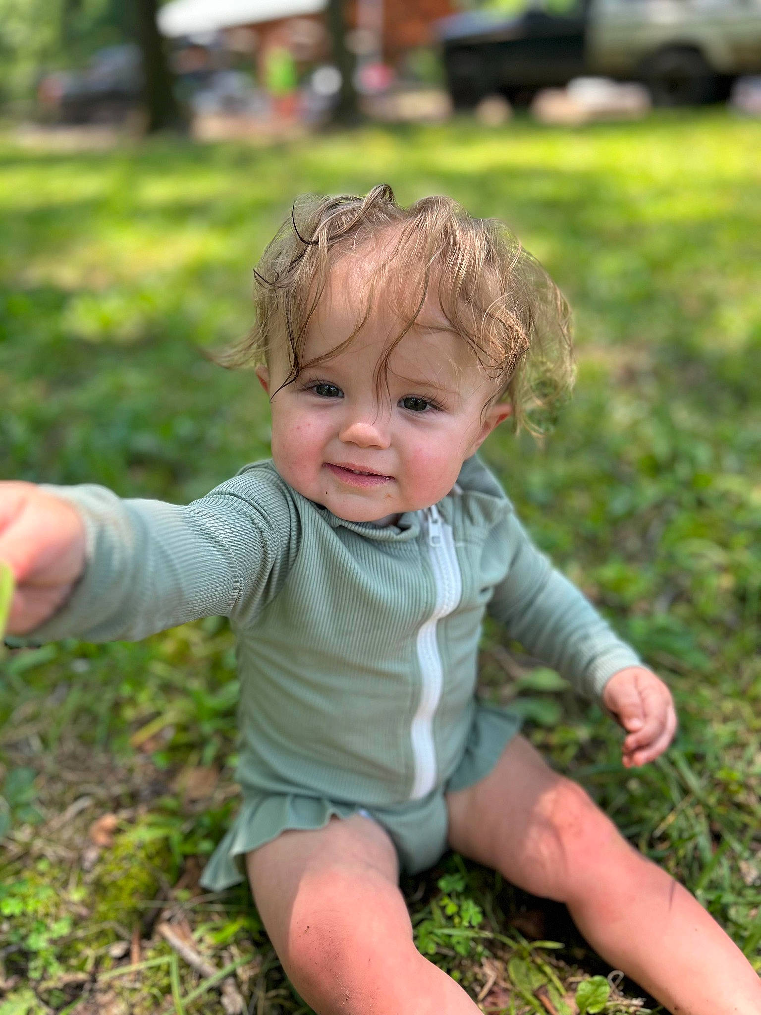 Hadley joined the competition — help win amazing prizes! baby, baby_toddler_clothing, child, eye, fun, garden, grass, grass_family, grassland, happy, joy, lawn, leaf, leisure, people_in_nature, person, plant, sitting, skin, smile