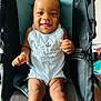 Nhyree joined the competition — help win amazing prizes! baby, smile, child, stroller, blue_clothing, hair_buns, happy, infant, sitting, indoor, cute, skin, face, portrait, hands, legs, romper, seat, playful, adorable