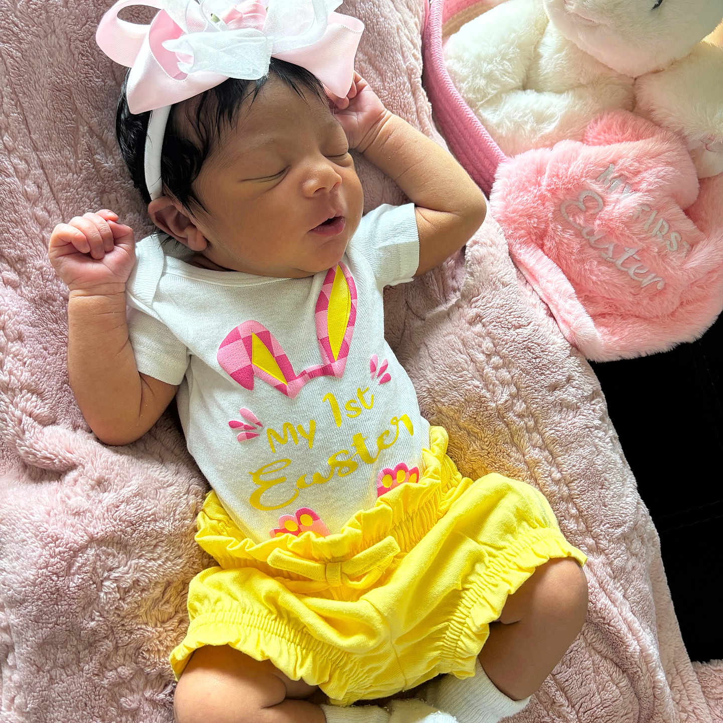 Khamori is registered to the contest to win money with this photo: baby, newborn, sleeping, pink_bow, yellow_shorts, white_socks, plush_toy, pink_blanket, easter, holiday, infant, cute, soft_texture, indoors, resting, child, headband, smiling_toy, toddler, clothing