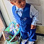 Derek is registered to the contest to win money with this photo: child, boy, blue_suit, bow_tie, toys, bucket, door, indoor, floor, curly_hair, sneakers, standing, portrait, looking_away, clothing, casual, playful, young, person, window
