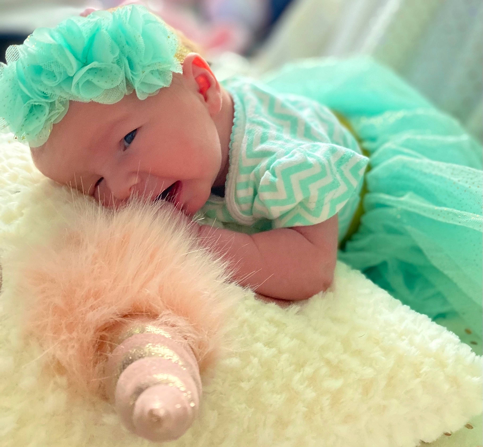 Aubrey is registered to the contest to win money with this photo: baby, baby_products, baby_sleeping, baby_toddler_clothing, beanie, cap, child, comfort, finger, fun, fur, happy, headwear, linens, magenta, person, pink, plush, skin, smile