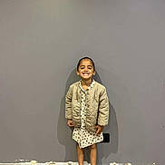 Rose a rejoint le concours — aidez-le/la à gagner de superbes lots ! casual, child, clothing, cute, dress, fashion, feet, floor, girl, happy, indoor, jacket, person, portrait, shoes, smiling, sneakers, standing, wall, young