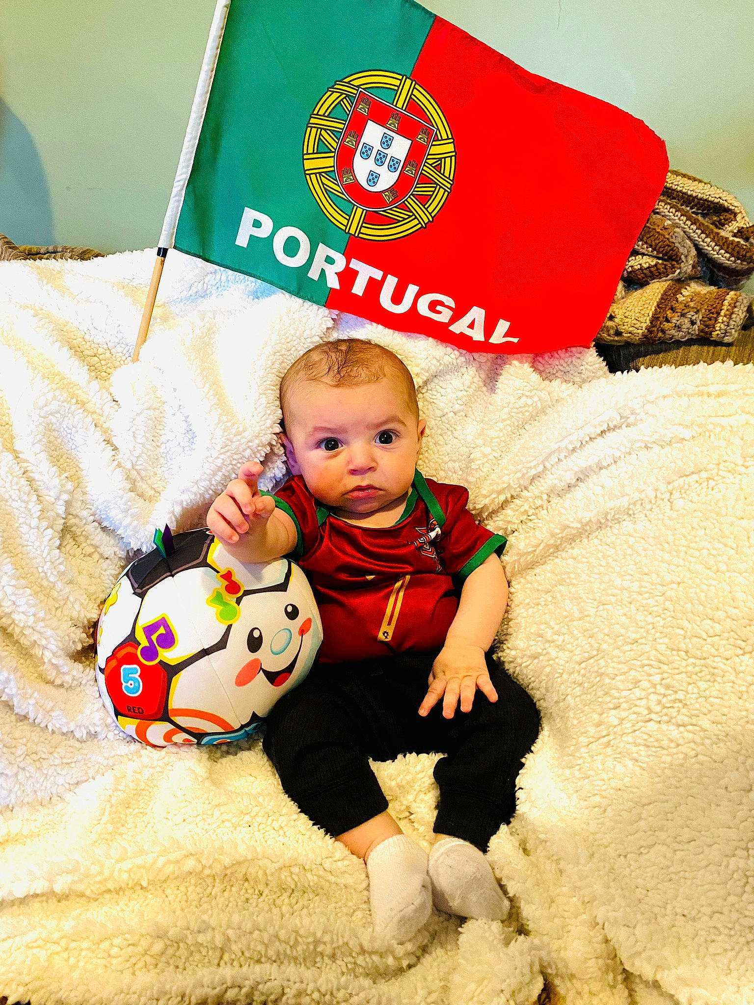 Bodhi joined the competition — help win amazing prizes! baby, baby_toddler_clothing, ball, carmine, child, christmas, christmas_eve, comfort, event, fictional_character, flooring, happy, head, holiday, linens, person, red, sitting, throw_pillow, toddler