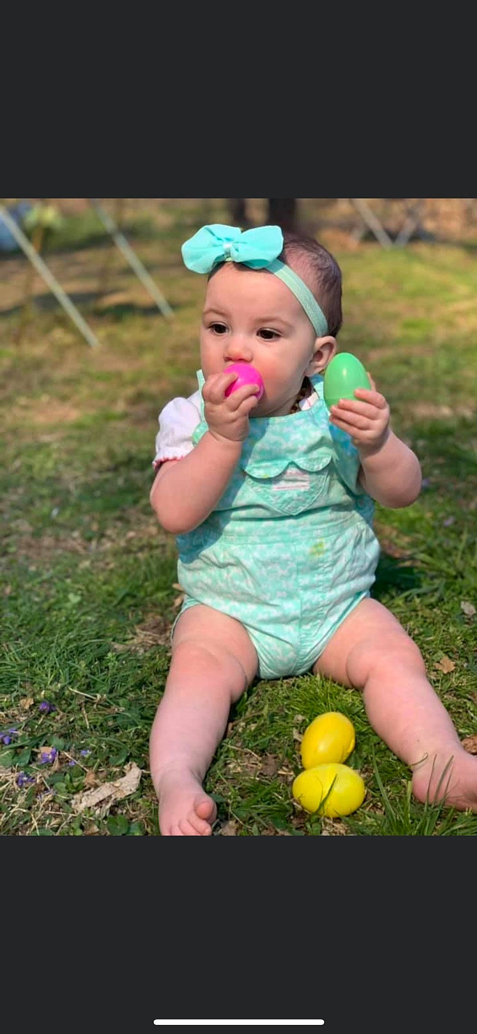 Aurora is registered to the contest to win money with this photo: baby, baby_toddler_clothing, ball, cap, child, face, finger, fun, grass, grassland, hand, happy, headwear, lawn, leaf, leisure, people_in_nature, person, plant, recreation