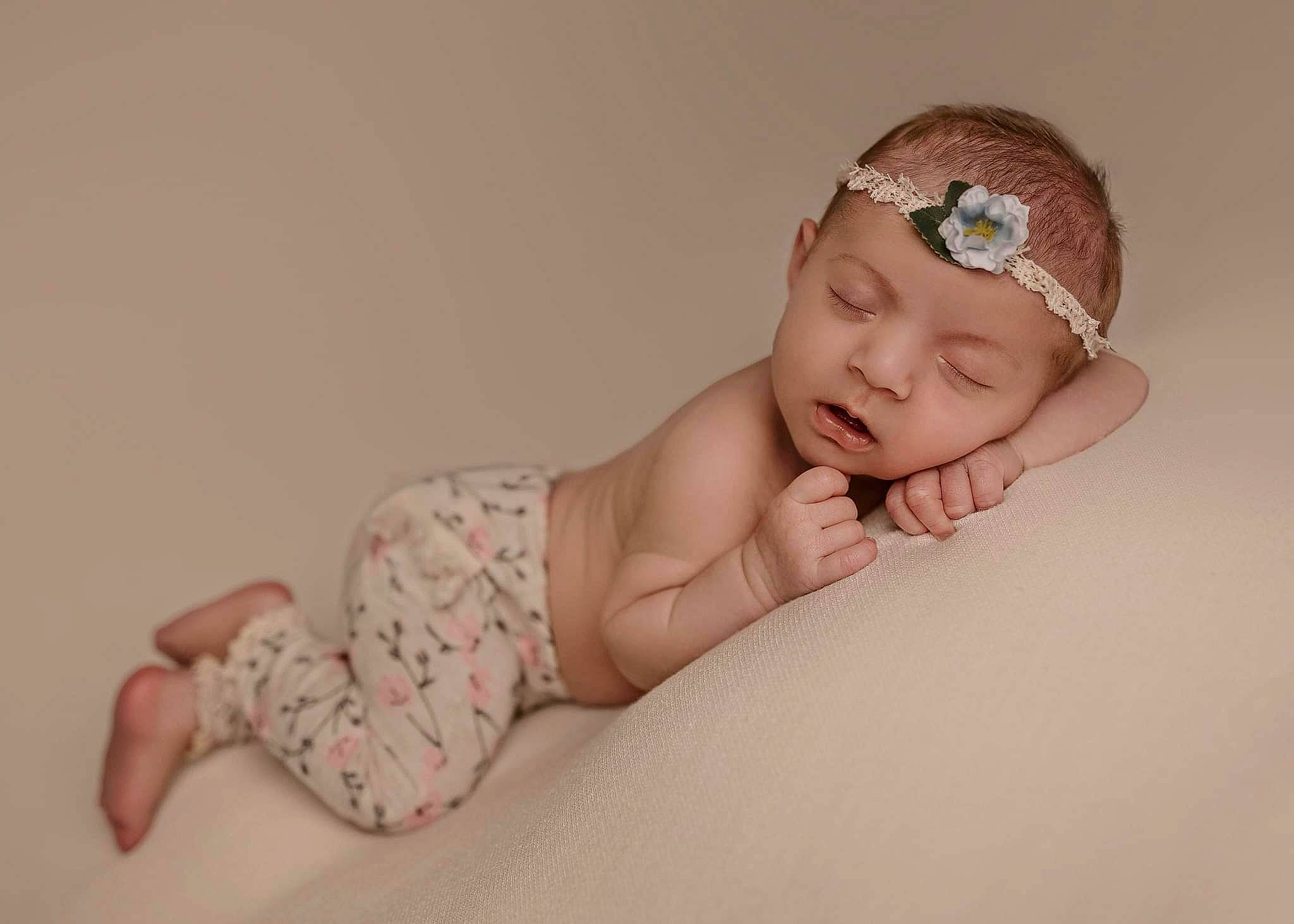 Raelynn Leigh is registered to the contest to win money with this photo: arm, baby, baby_toddler_clothing, cap, child, comfort, fashion_accessory, flash_photography, foot, goggles, happy, headband, headpiece, headwear, human_leg, jewellery, linens, nail, person, sitting