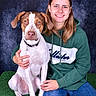 Ace a rejoint le concours — aidez-le/la à gagner de superbes lots ! animal, backdrop, brown_and_white, collar, companion, dog, front_facing, grass_mat, green_hoodie, indoor, jeans, leash, pet_owner, photography, portrait, short_hair, sitting, smiling, studio, woman