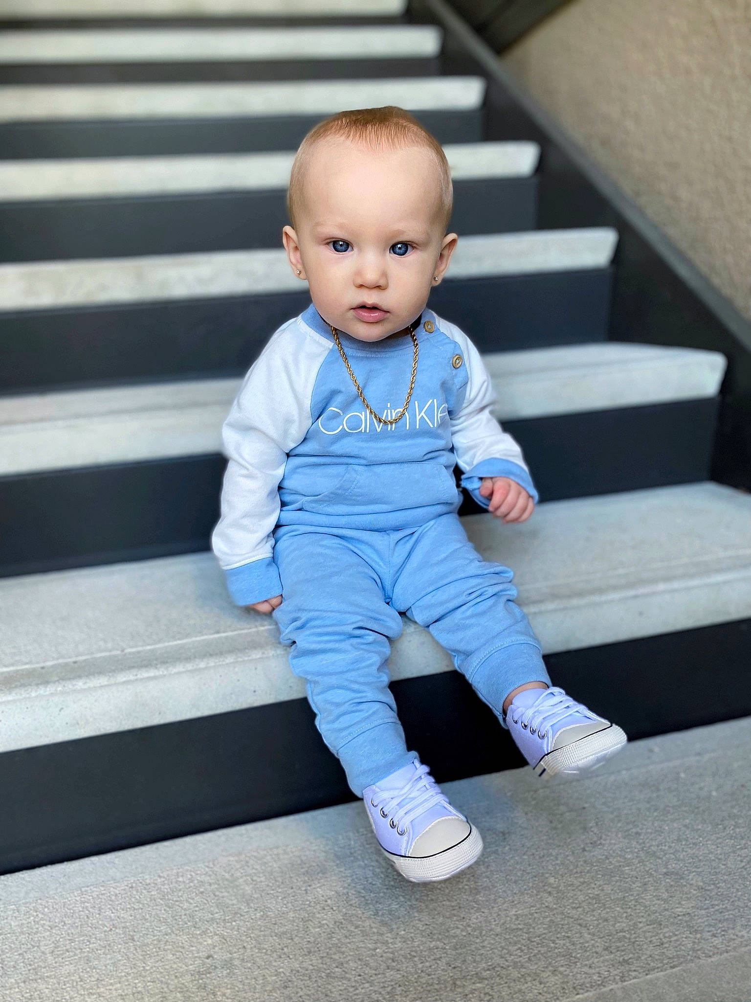 Kaison is registered to the contest to win money with this photo: baby, baby_toddler_clothing, child, denim, electric_blue, eye, face, flash_photography, flooring, grey, happy, head, human_body, human_leg, pattern, person, sleeve, stairs, t_shirt, toddler