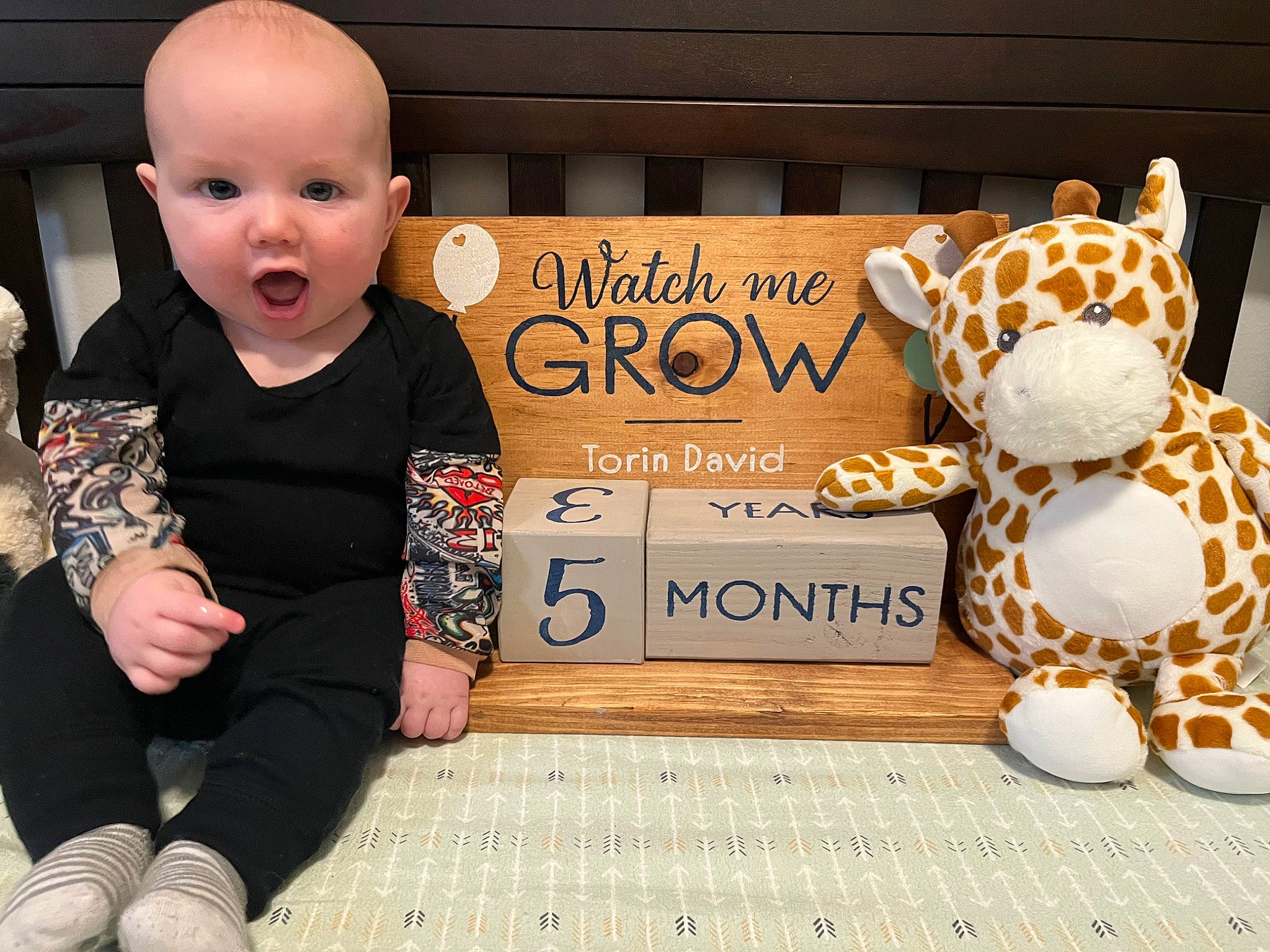 Torin joined the competition — help win amazing prizes! baby, baby_toddler_clothing, big_cats, cheetah, child, felidae, flooring, font, fur, happy, head, pattern, person, product, sitting, sleeve, surprise, t_shirt, terrestrial_animal, toddler