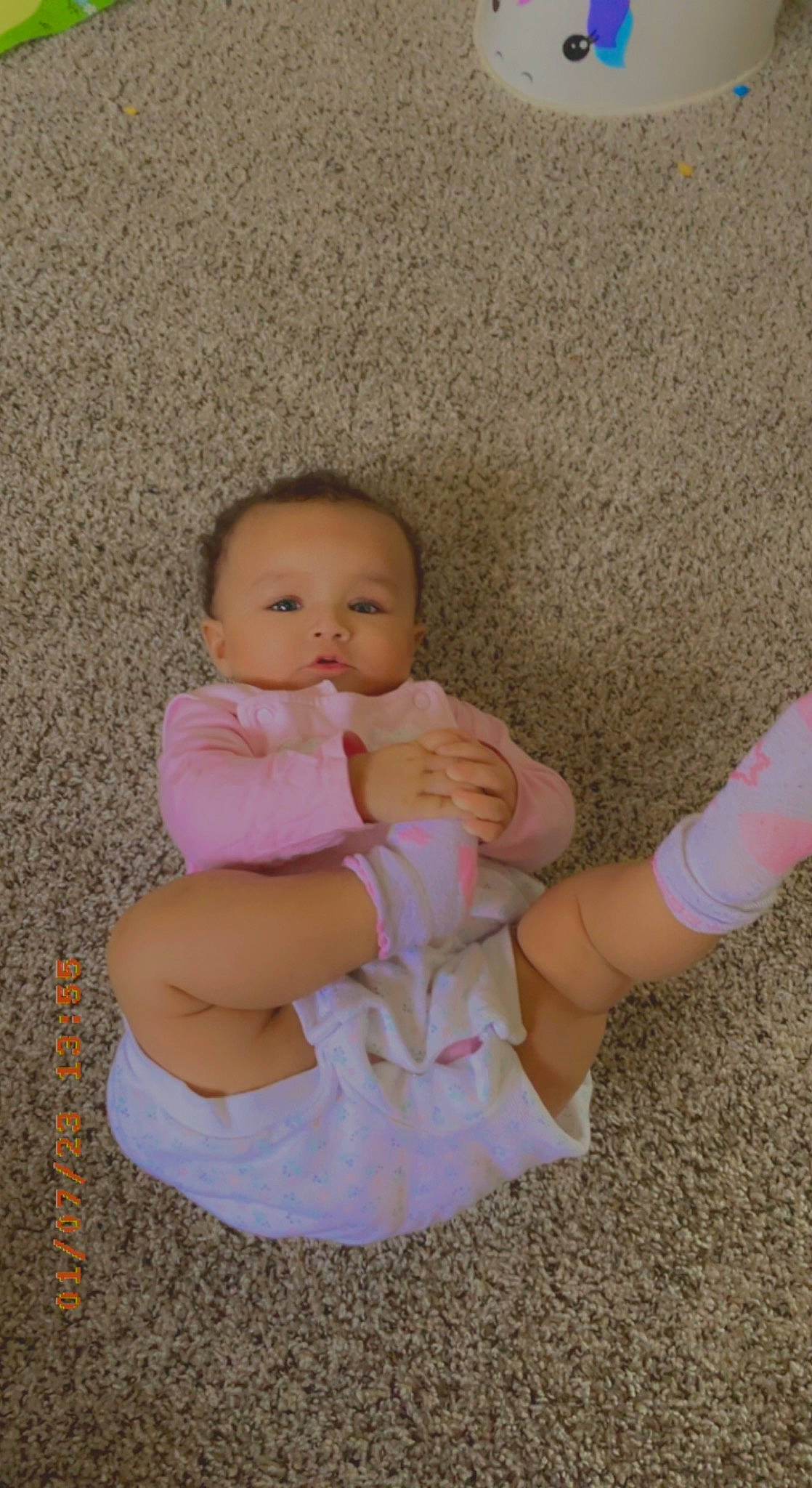 Gigi is registered to the contest to win money with this photo: abdomen, baby, baby_toddler_clothing, barefoot, cheek, comfort, elbow, finger, foot, gesture, human_body, human_leg, knee, nail, person, sitting, skin, stomach, thigh, thumb