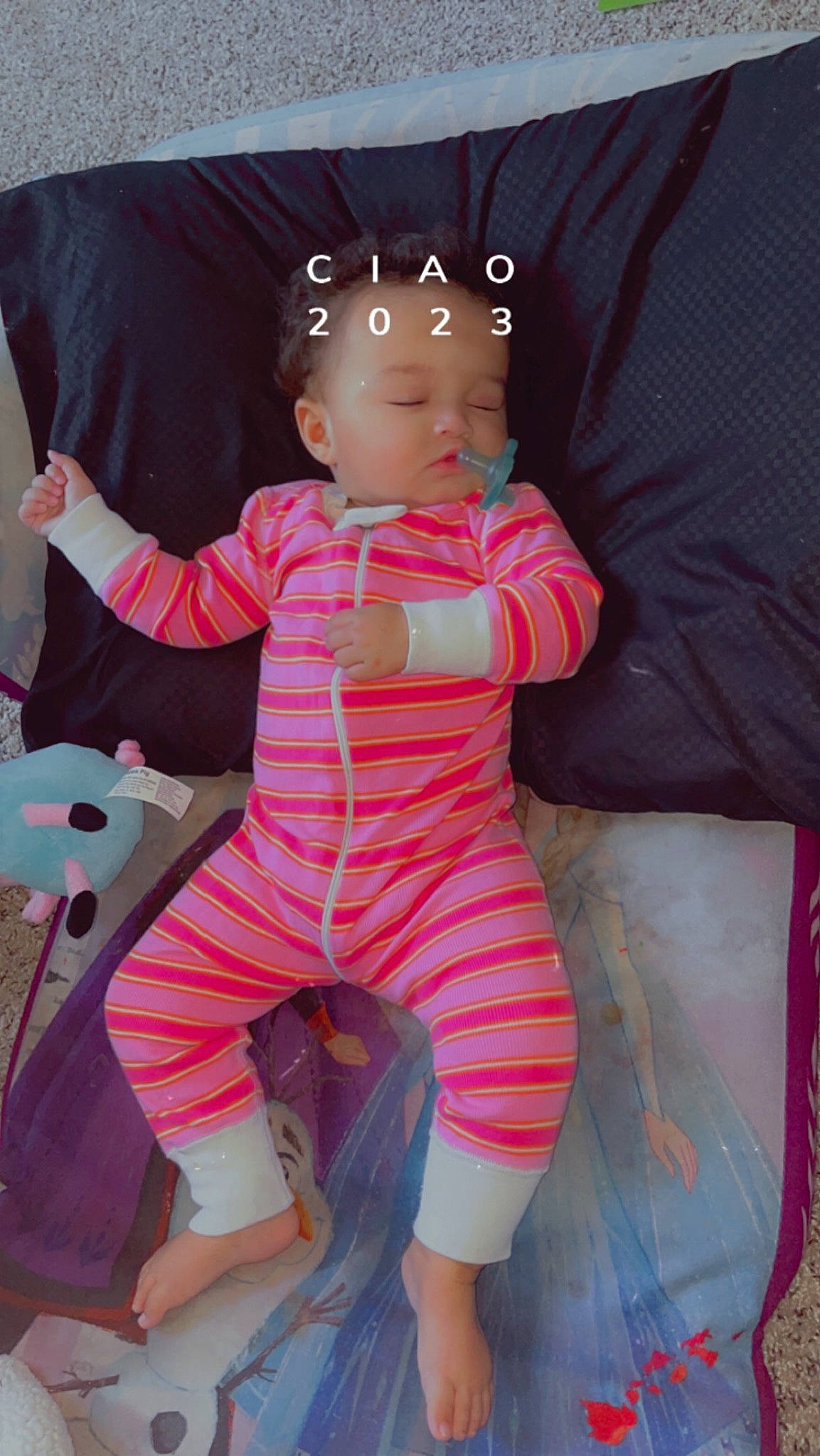 Gigi is registered to the contest to win money with this photo: baby, baby_toddler_clothing, cheek, child, comfort, finger, fun, gesture, happy, human_leg, linens, magenta, pattern, person, pink, sitting, skin, sleeve, thigh, thumb