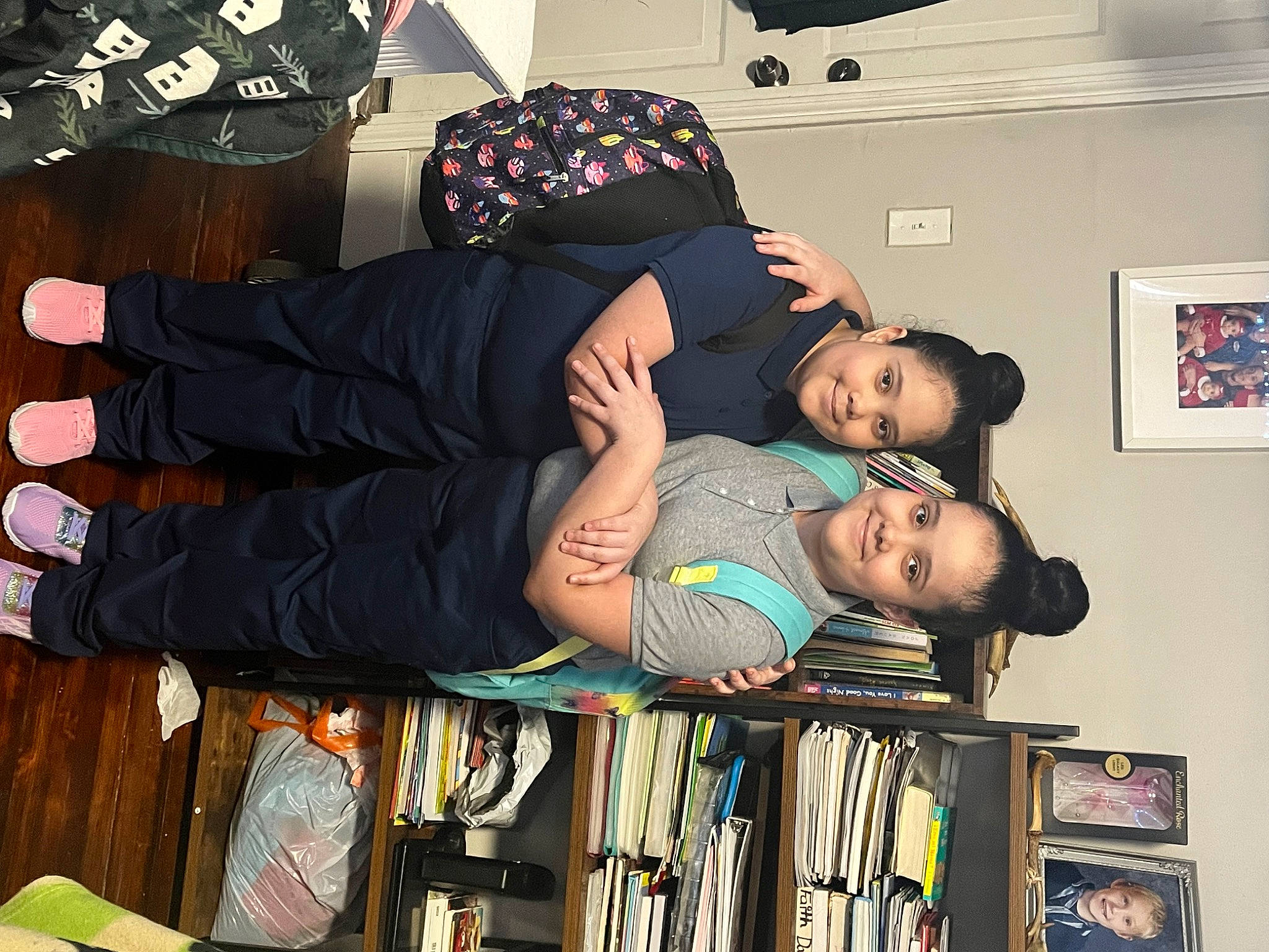 Maria joined the competition — help win amazing prizes! black_hair, book, bookcase, child, dress, fashion_design, fun, gesture, happy, human_leg, joy, person, photograph, photography, picture_frame, publication, room, shelf, shelving, snapshot