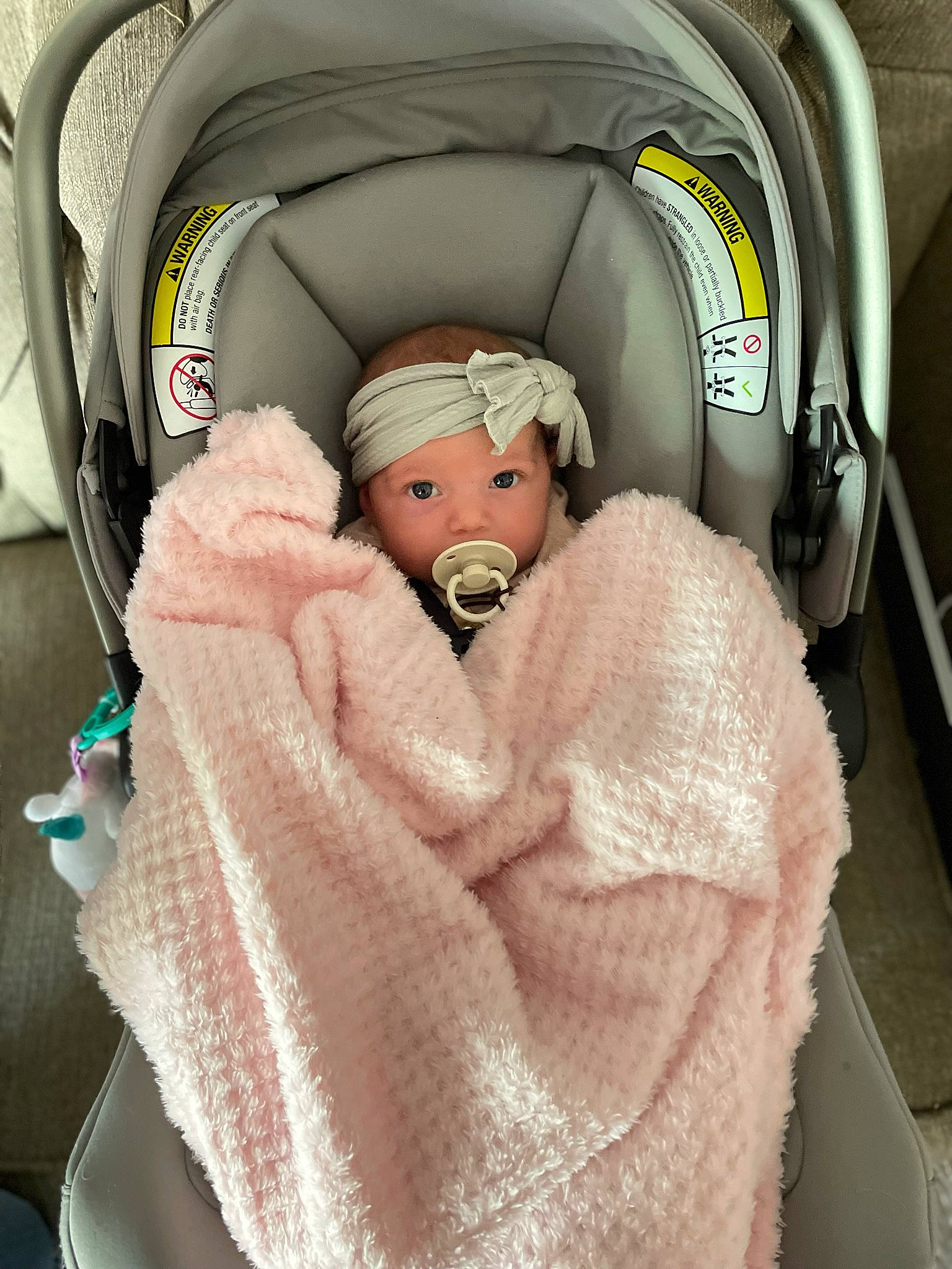 Bellamy is registered to the contest to win money with this photo: auto_part, automotive_design, baby, baby_products, baby_safety, baby_sleeping, car_seat, child, comfort, family_car, fur, head_restraint, headwear, infant_bed, linens, luxury_vehicle, motor_vehicle, peach, person, room