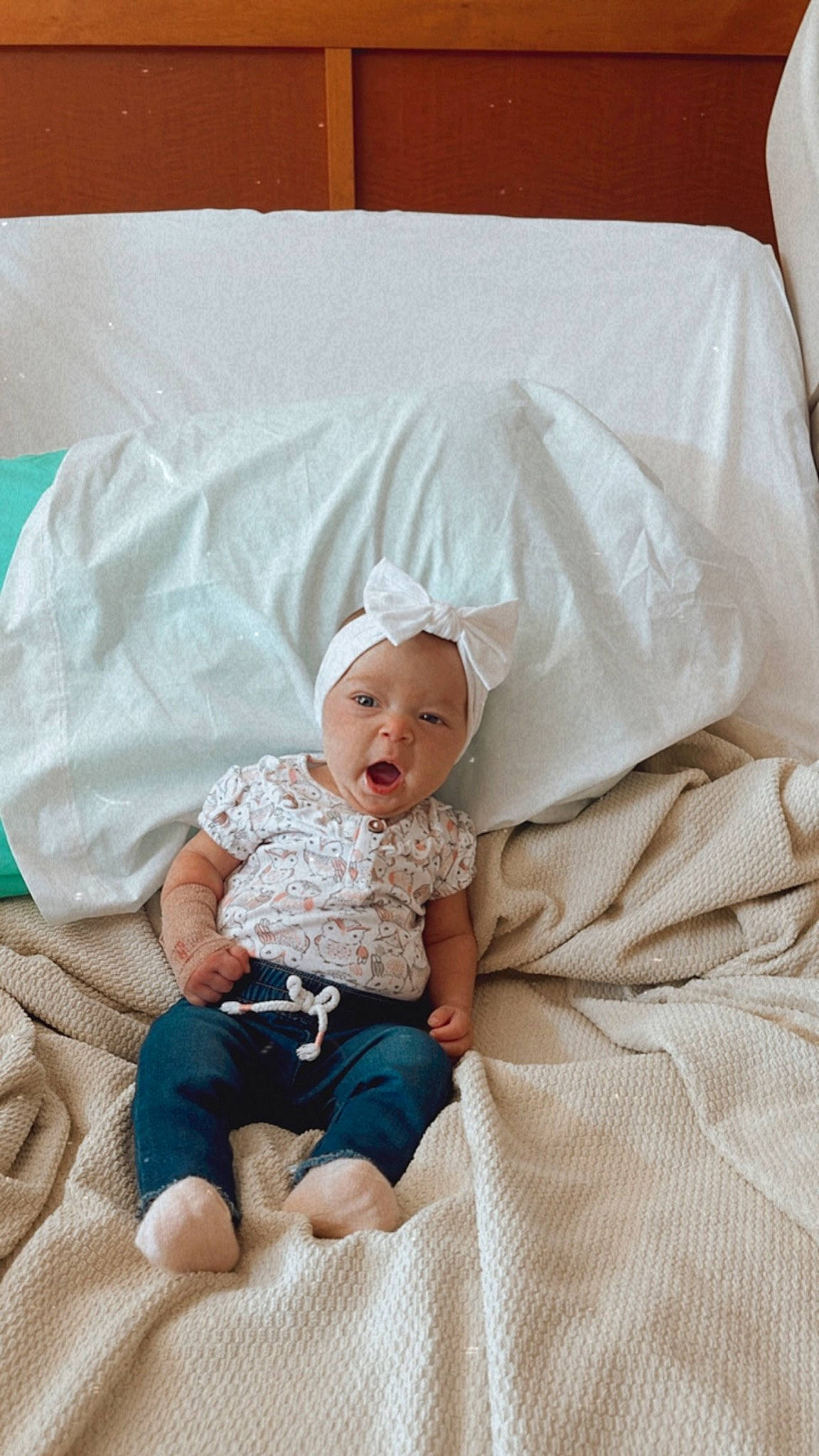 Bellamy is registered to the contest to win money with this photo: baby, baby_products, baby_sleeping, baby_toddler_clothing, child, comfort, couch, face, hat, head, headwear, linens, person, product, room, sitting, skin, sleeve, smile, t_shirt