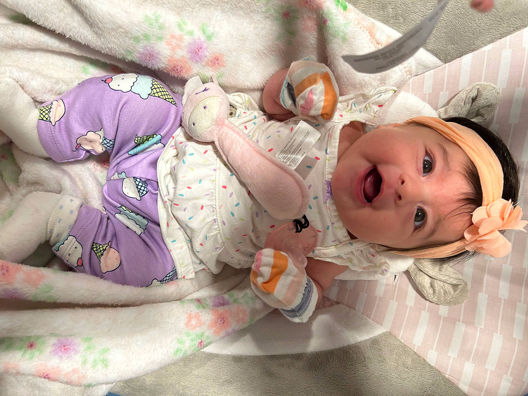 Elsie joined the competition — help win amazing prizes! arm, baby, baby_products, baby_toddler_clothing, cheek, child, comfort, finger, happy, hat, headwear, human_body, linens, pattern, person, pink, room, skin, smile, textile