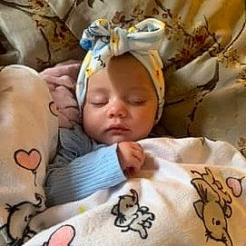 Azariah is registered to the contest to win money with this photo: adaptation, art, baby, baby_products, baby_safety, baby_toddler_clothing, cheek, child, comfort, eyelash, fun, happy, head, headwear, mouth, person, photo_caption, product, skin, sleeve