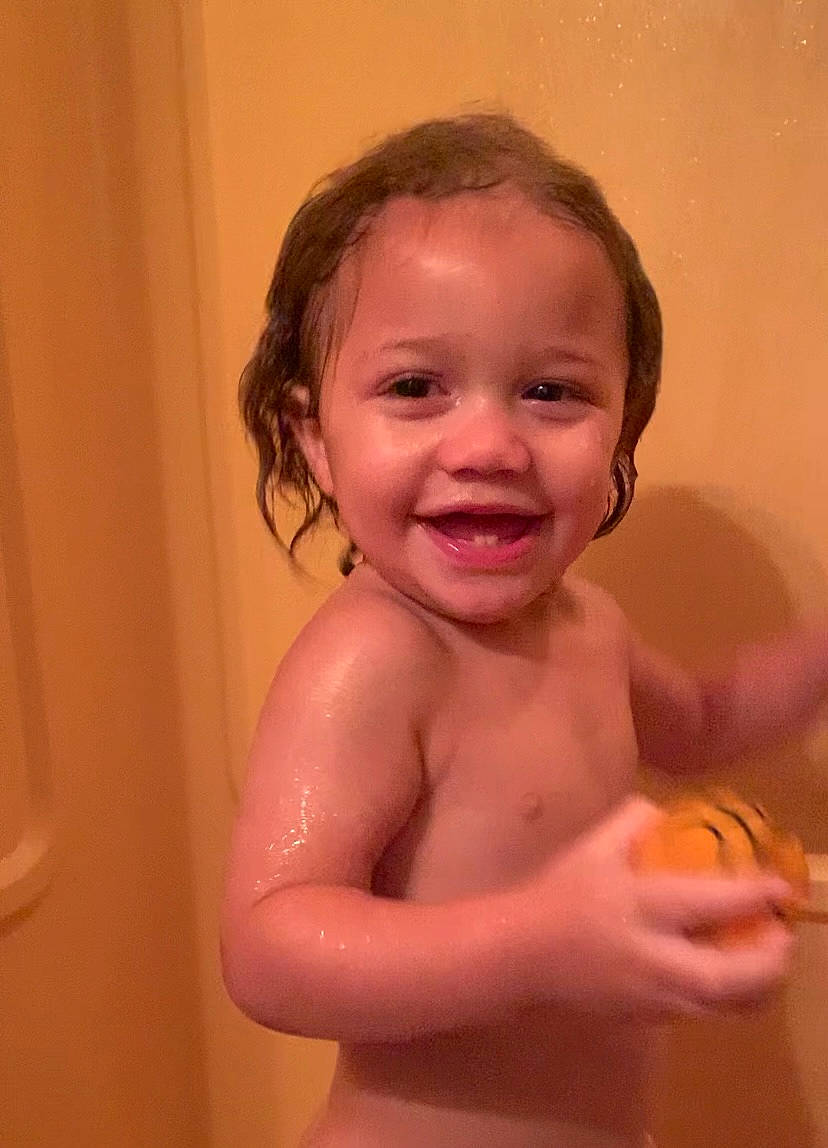 Aaydin is registered to the contest to win money with this photo: arm, baby_bathing, bathroom, cheek, dress, eye, eyelash, face, gesture, hair, hand, happy, iris, jaw, joy, lip, mouth, neck, nose, person