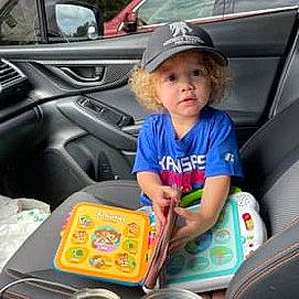 Aaydin is registered to the contest to win money with this photo: auto_part, automotive_design, automotive_exterior, automotive_window_part, car, car_seat, car_seat_cover, child, electric_blue, family_car, headwear, luxury_vehicle, motor_vehicle, person, product, snapshot, steering_wheel, t_shirt, toddler, travel